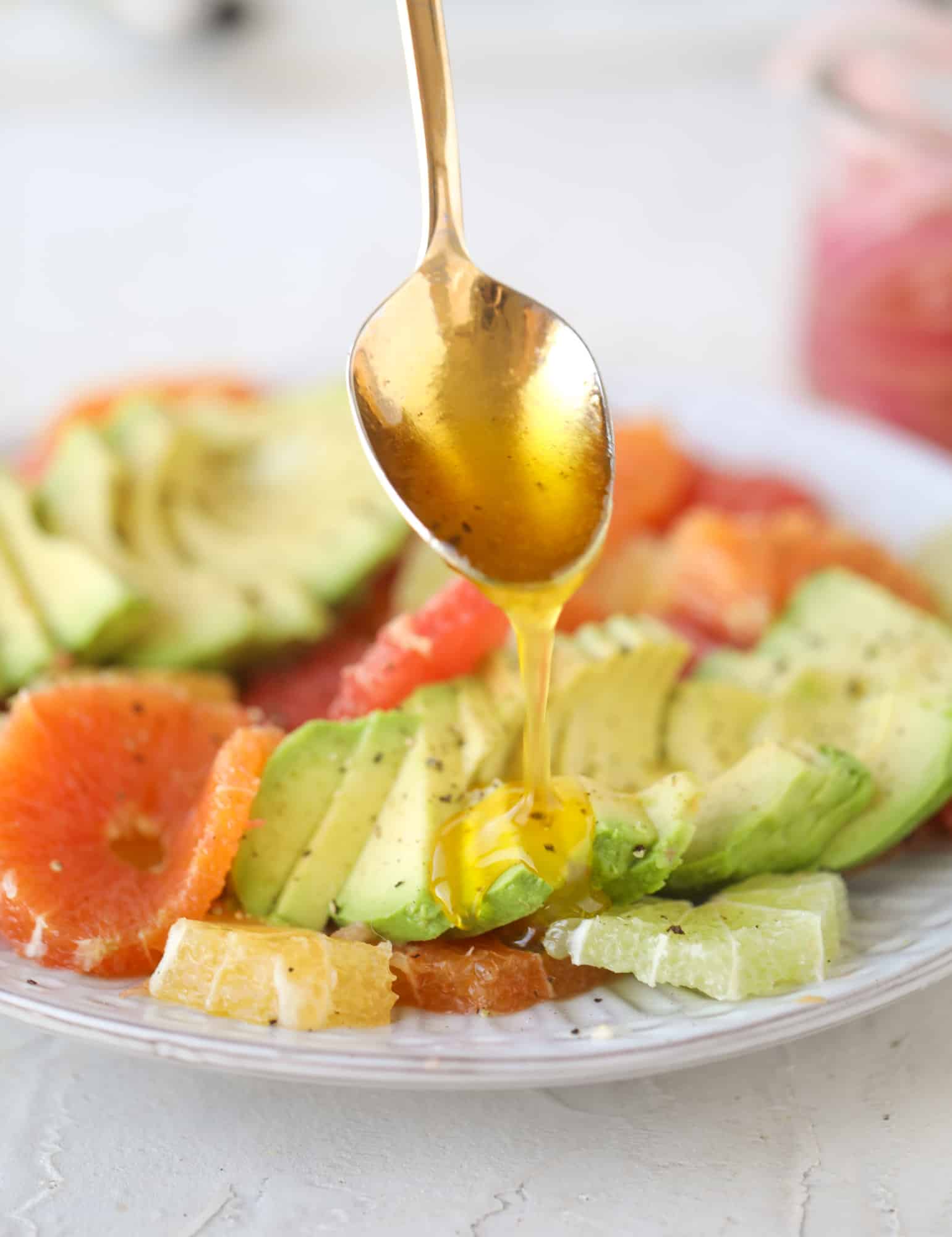 A deliciously fresh and invigorating avocado citrus salad with honey lime vinaigrette. It's creamy, tart, sweet and refreshing! I howsweeteats.com #avocado #citrussalad