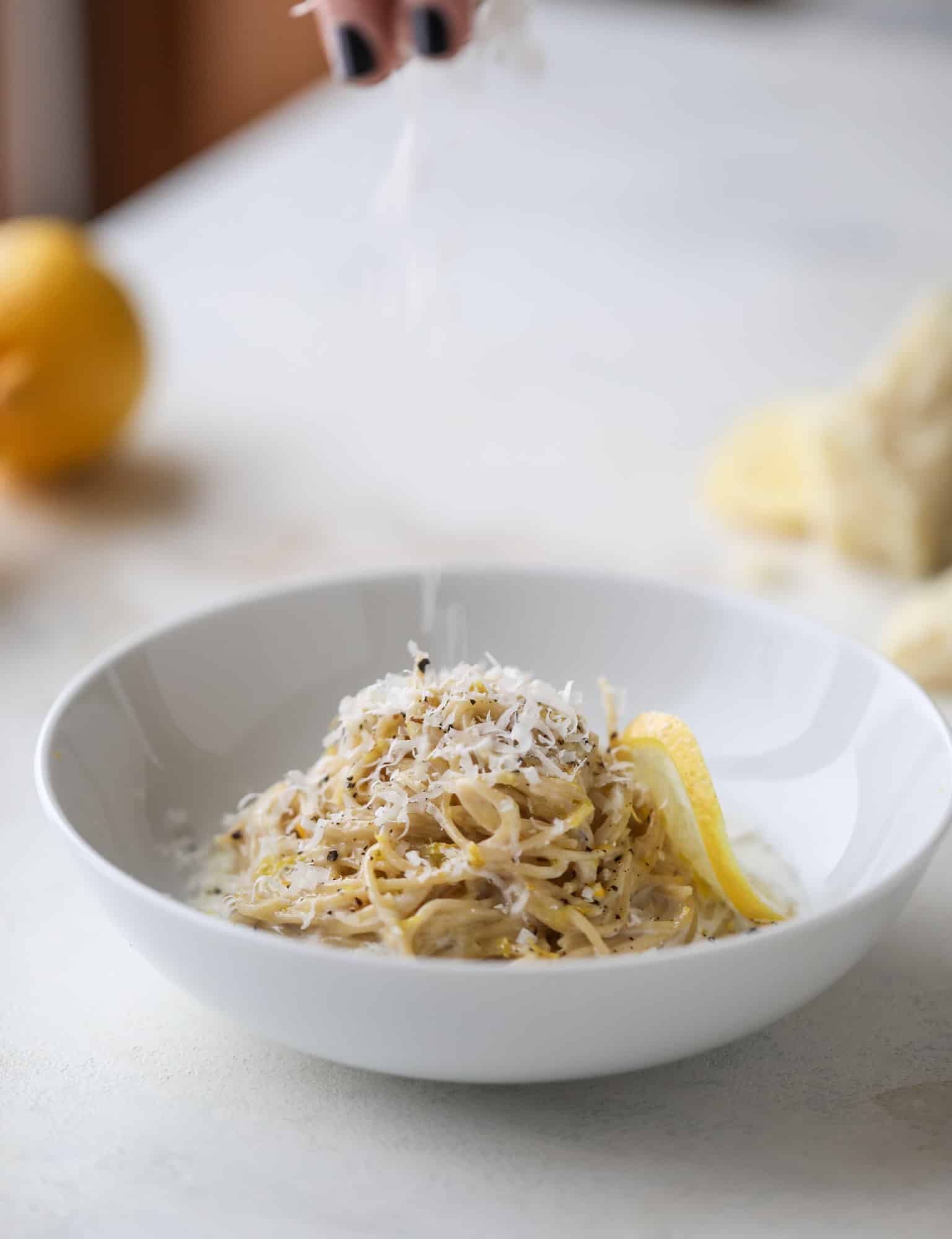 This cozy lemon pasta is light, refreshing and perfect for dinner when paired with a simple greens salad. It comes together in 20 minutes! I howsweeteats.com #lemon #pasta