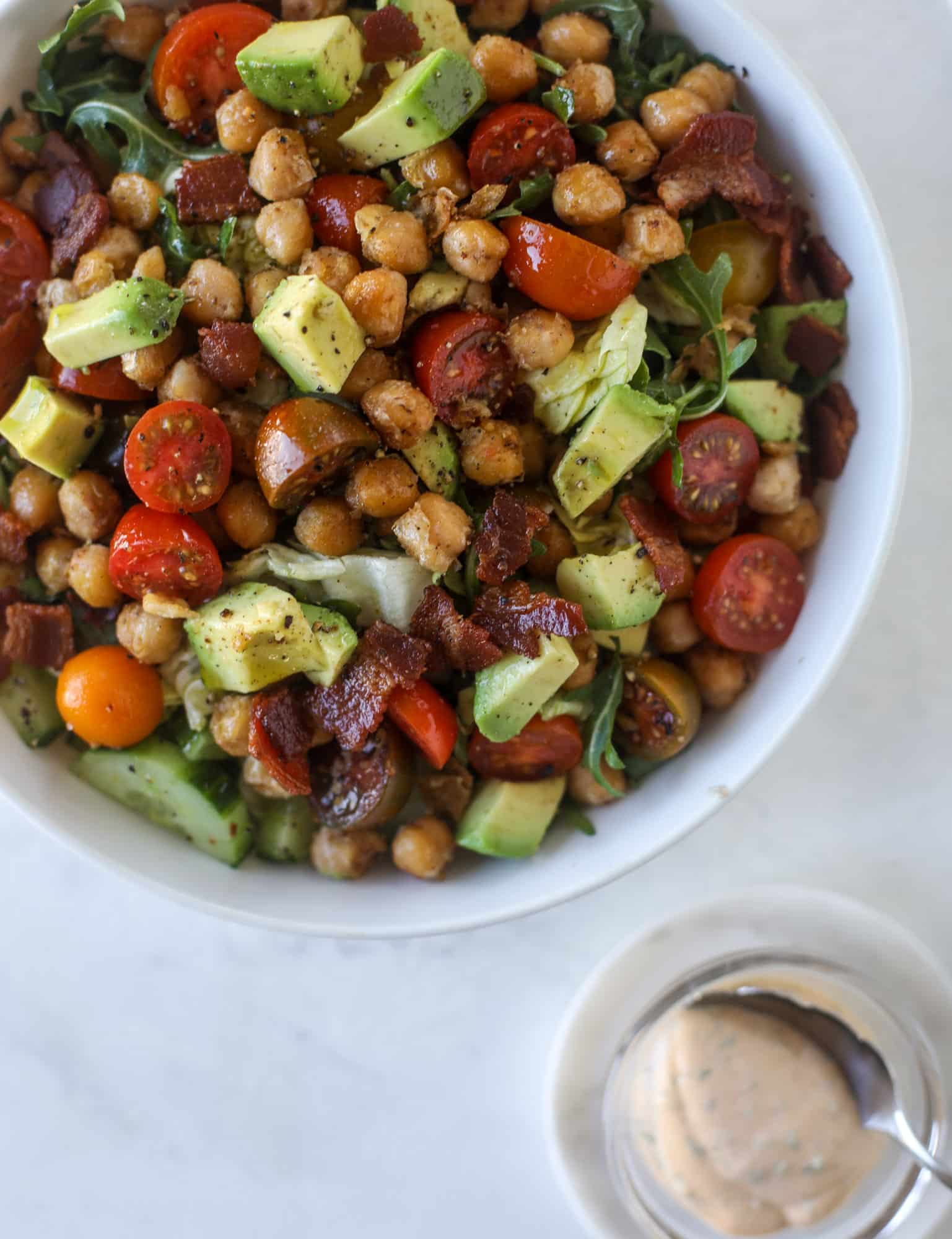 The chickpea bacon ranch salad has a ton of crispy, crunchy texture and flavor. It's satisfying and super easy to prep ahead of time too! I howsweeteats.com #chickpea #salad