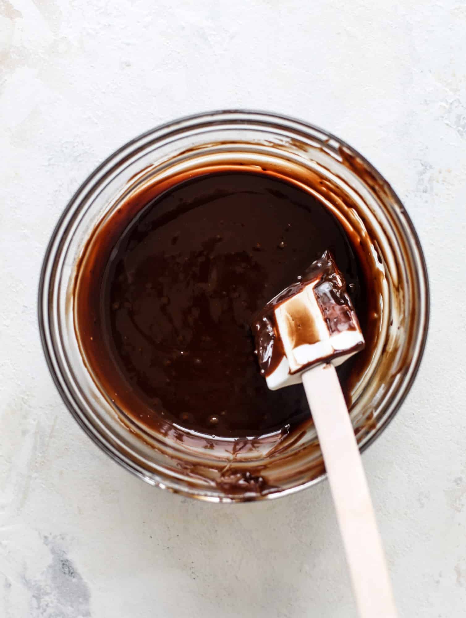 Classic chewy, slightly gooey coconut macaroons dipped in an irish cream chocolate ganache. Easy to make and gluten free too! I howsweeteats.com #irishcream #coconutmacaroons