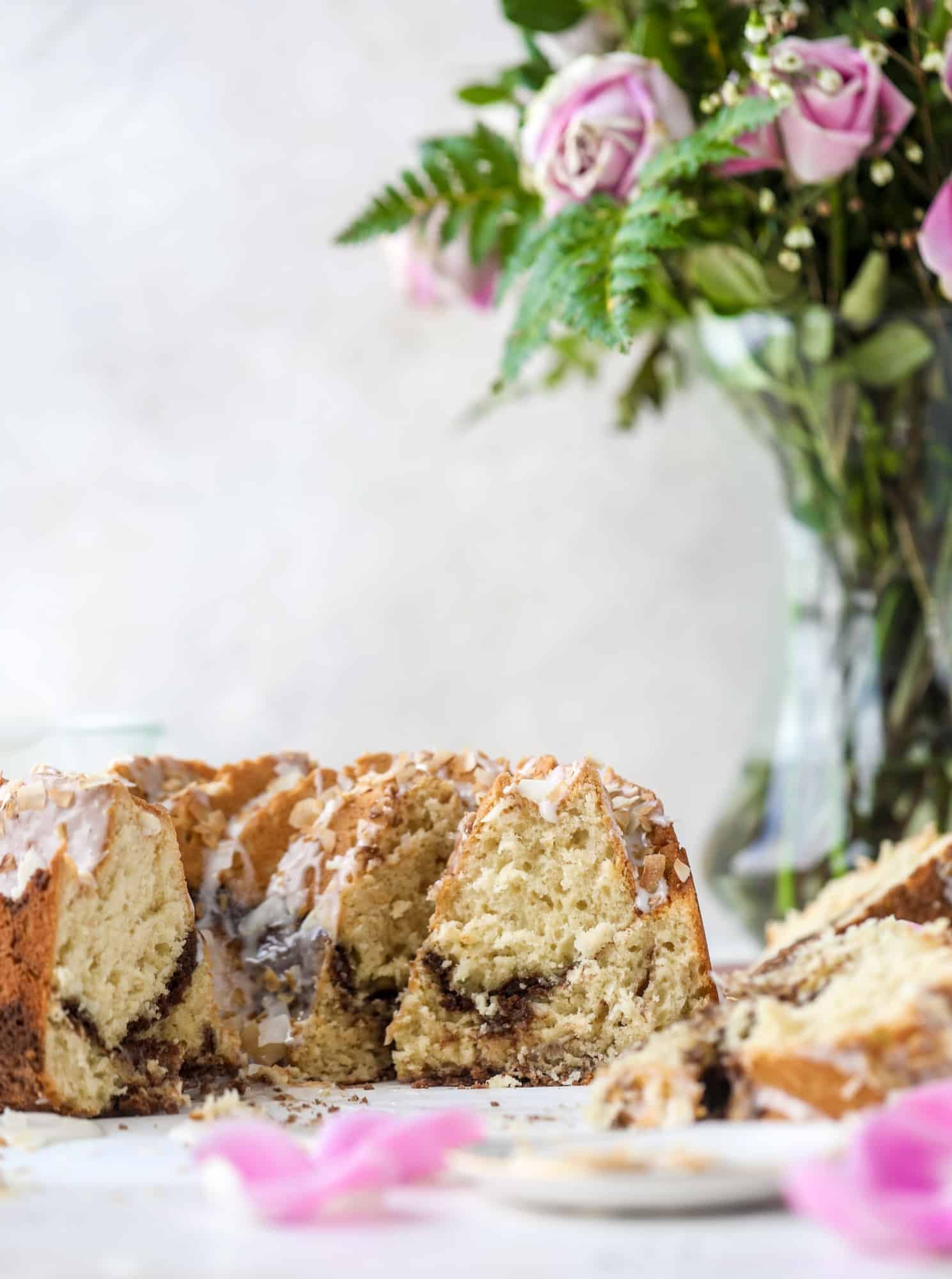 Make breakfast and brunch better with coconut coffee cake! Tender coconut cake with a cocoa sugar streusel and a coconut glaze. To die for!