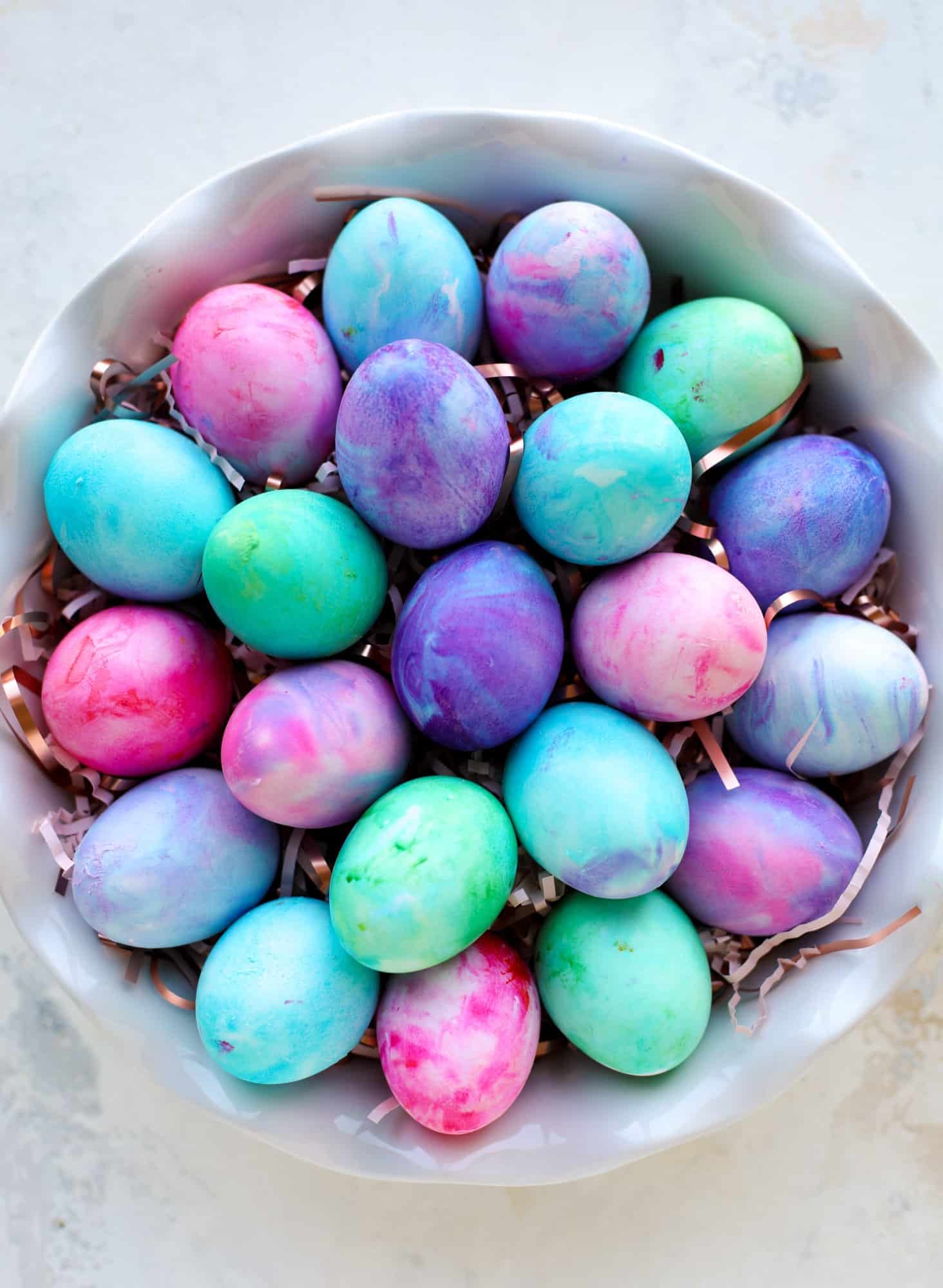 This is how to dye eggs with cool whip! It's so fun, super kid-friendly and ridiculously easy too. I love using this method to make unicorn eggs!