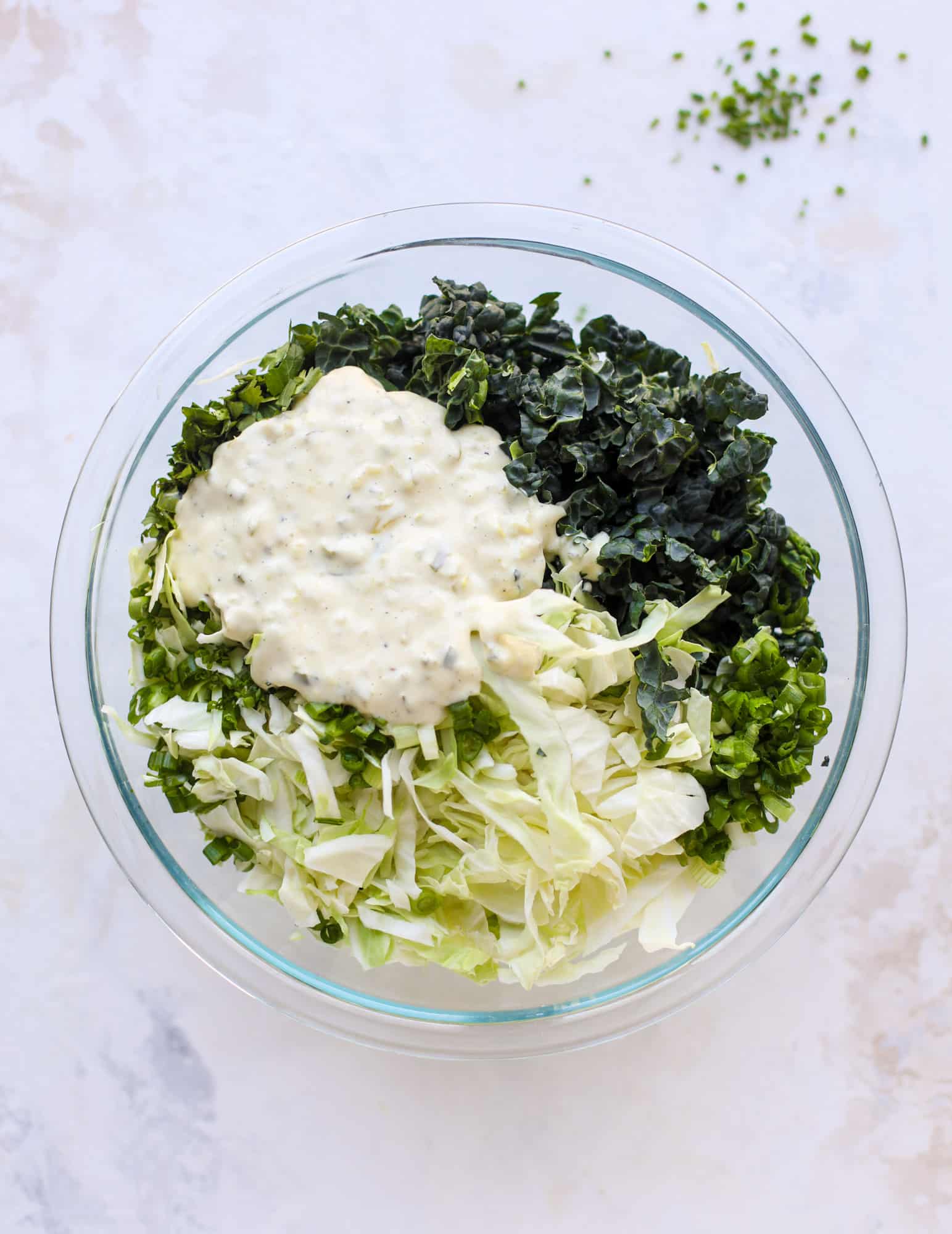 A light and crispy fish sandwich made with a simple beer batter and topped with a hearty, creamy kale cole slaw. Loaded with flavor! I howsweeteats.com #crispyfish #sandwich