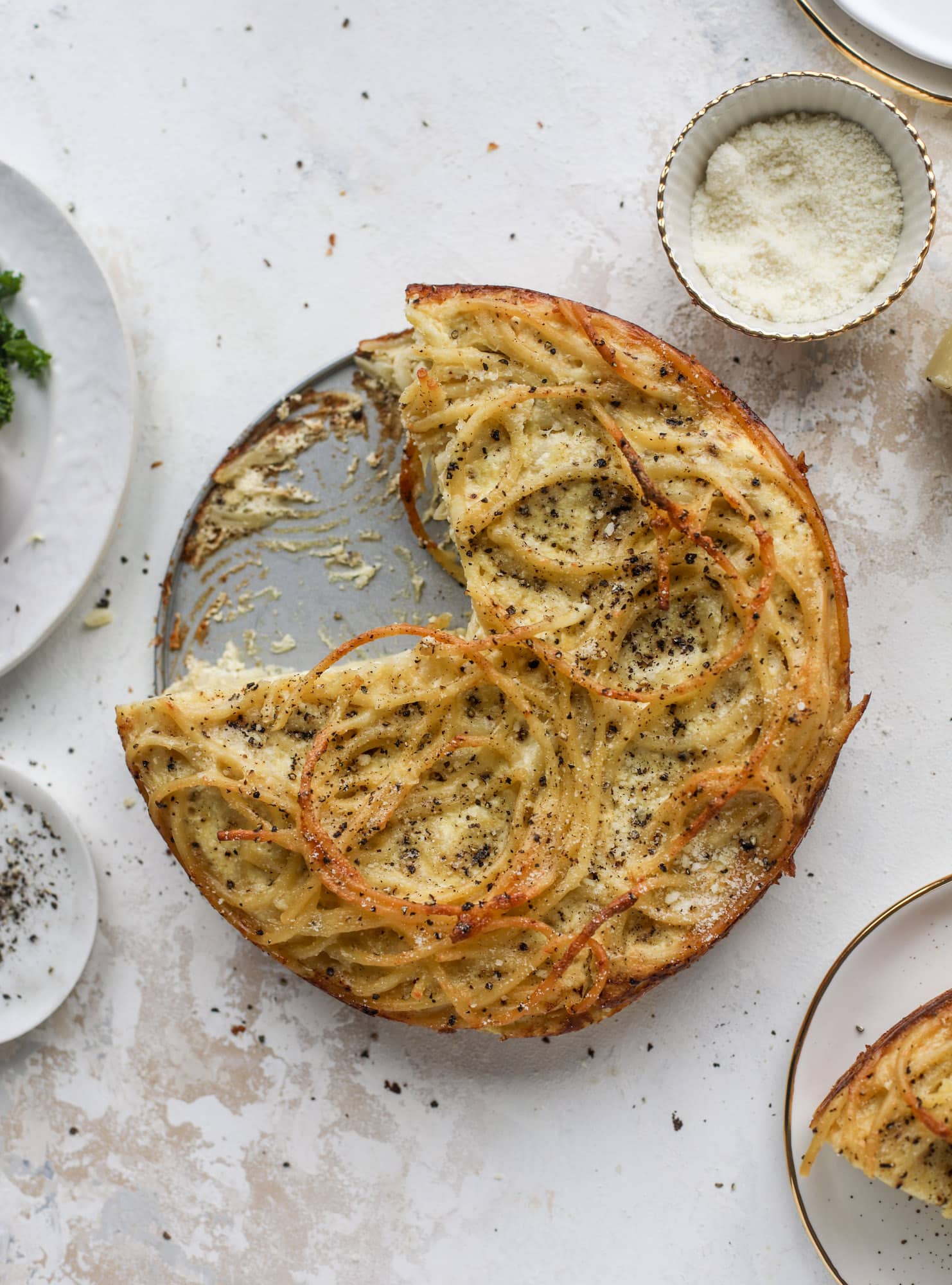 Hello lover! Cacio e pepe pie is made with parmigiano-reggiano cheese, black pepper and bucatini pasta. Baked until cheese and bubbly, it's to die for.