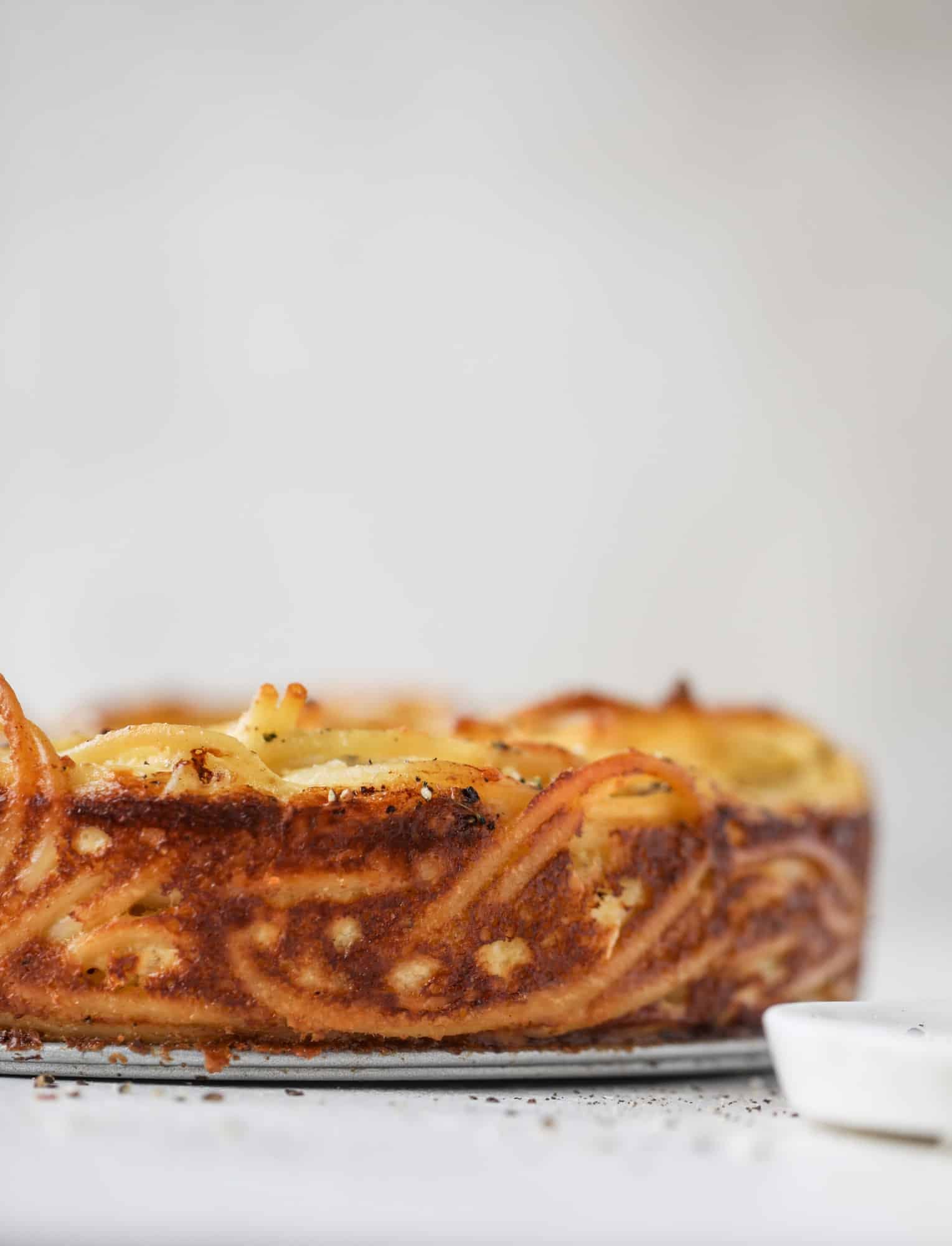 Hello lover! Cacio e pepe pie is made with parmigiano-reggiano cheese, black pepper and bucatini pasta. Baked until cheese and bubbly, it's to die for.