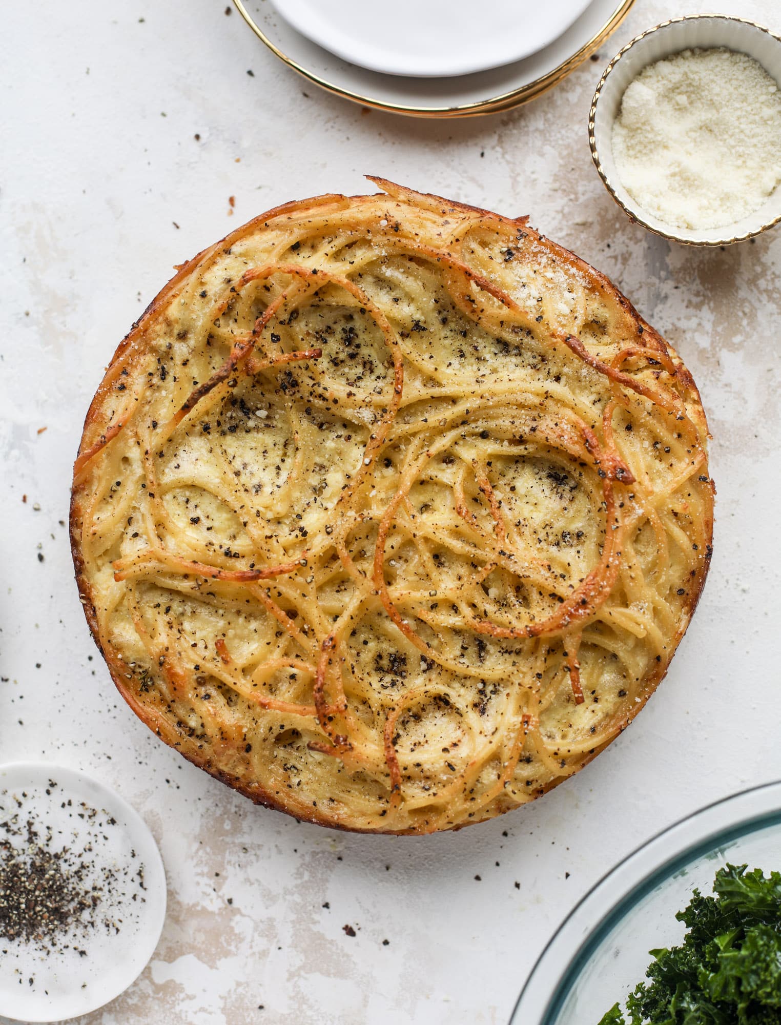 Hello lover! Cacio e pepe pie is made with parmigiano-reggiano cheese, black pepper and bucatini pasta. Baked until cheese and bubbly, it's to die for.