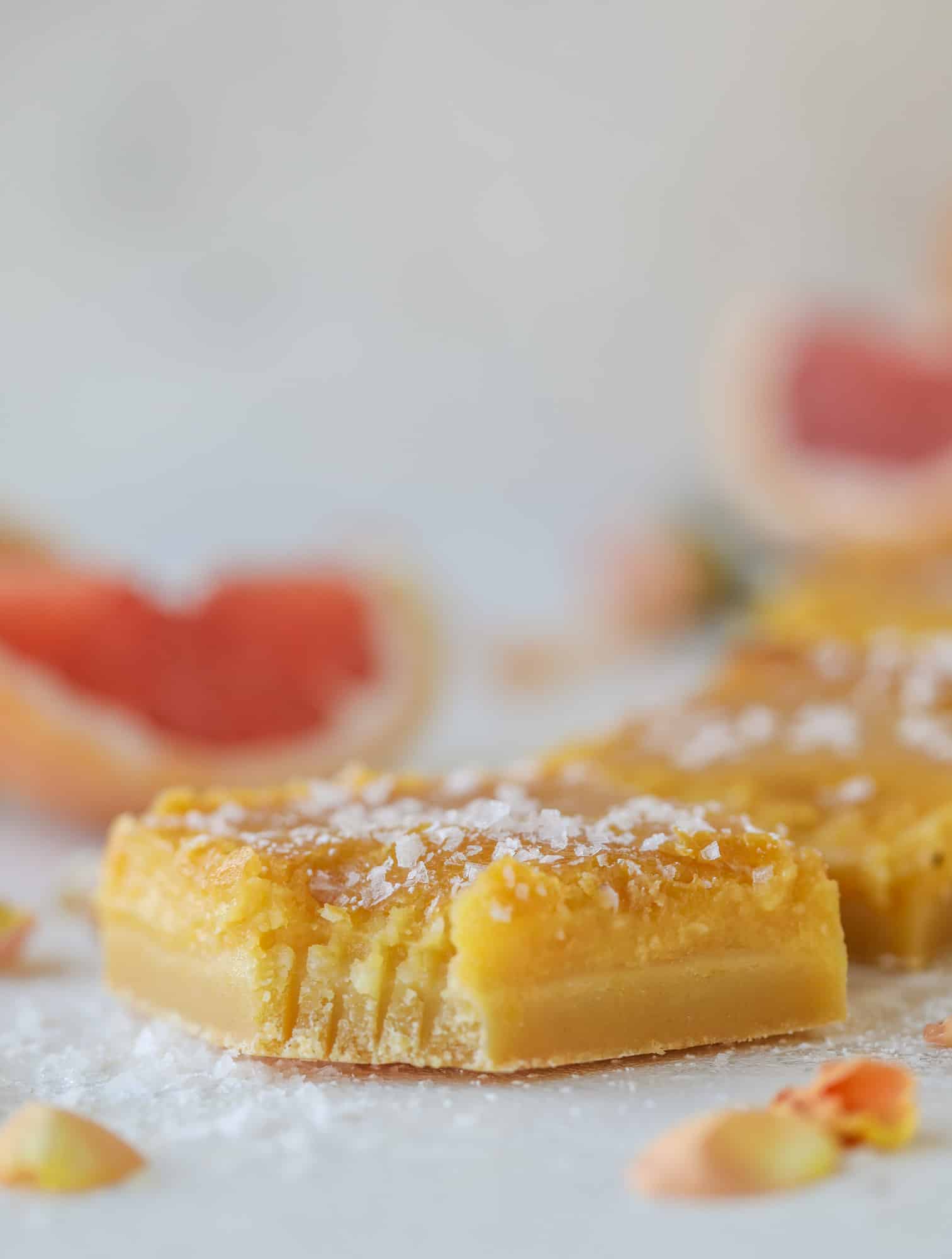 These salted citrus bars are made of both grapefruit and lemon curd on a buttery shortbread crust. Top with flaked sea salt for the perfect bite!