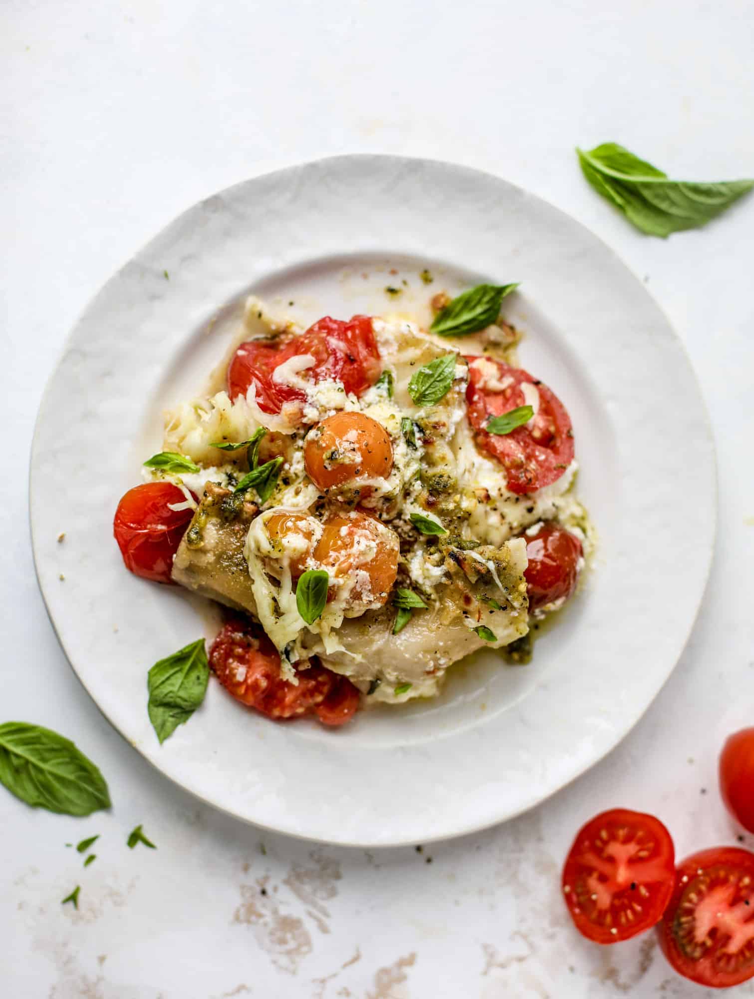 Quick caprese skillet lasagna is a lovely and comforting summer meal! Lots of fresh basil, ripe tomatoes and cheese bring this easy weeknight meal together.