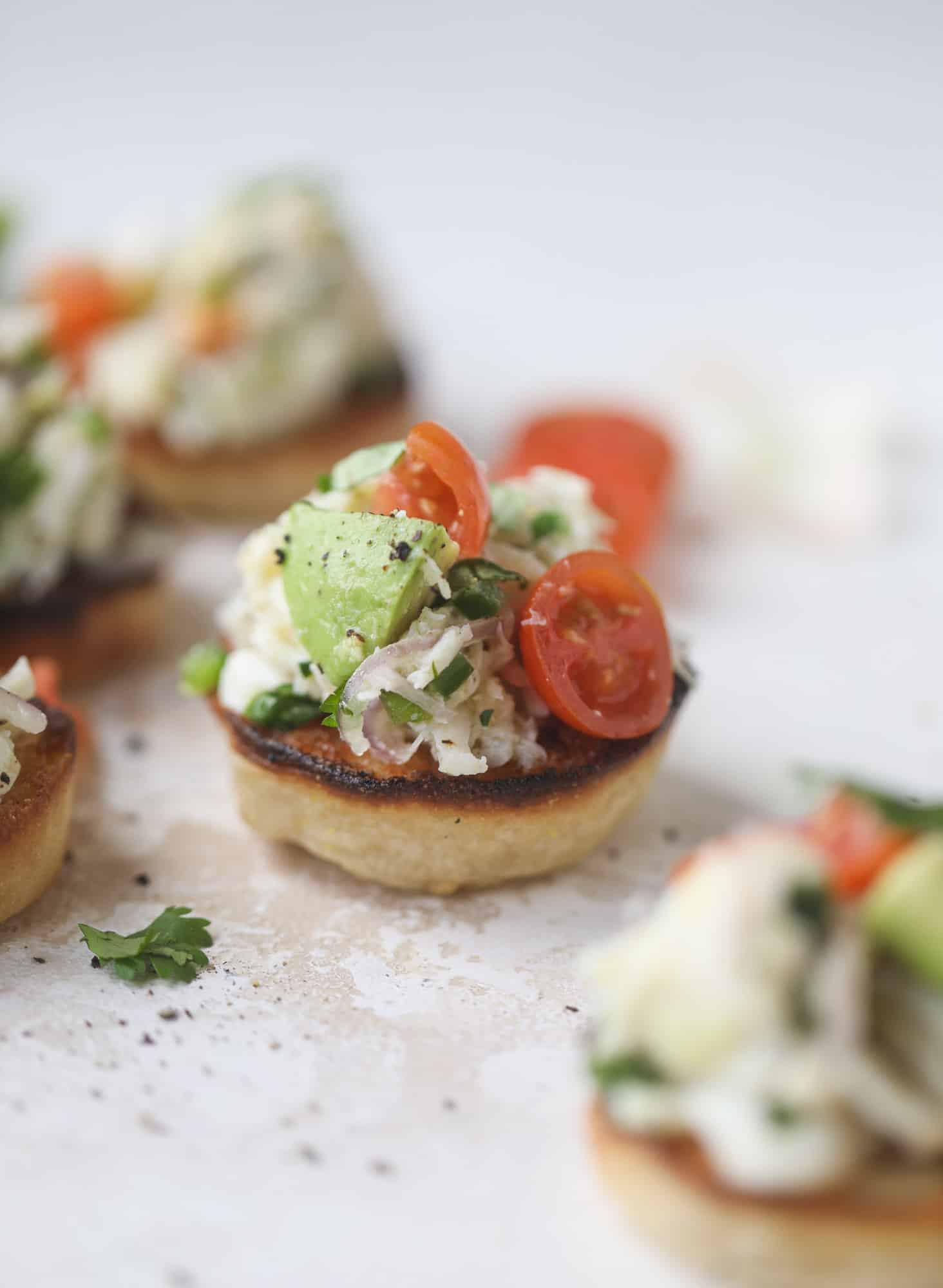 The cutest crab salad toasts are perfect for a snack, appetizer or light meal with a greens salad. This avocado crab salad is so refreshing and light!