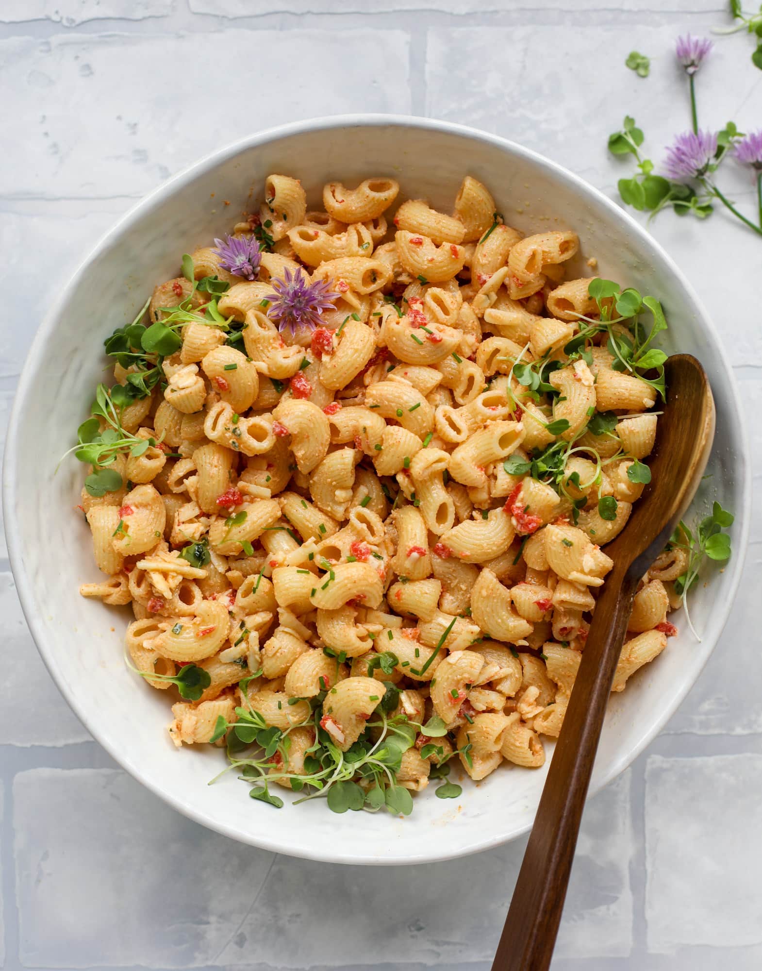 This pimento cheese pasta salad is the perfect summer side dish! All the flavor of pimento cheese and all the comforts of pasta salad, in one bowl!