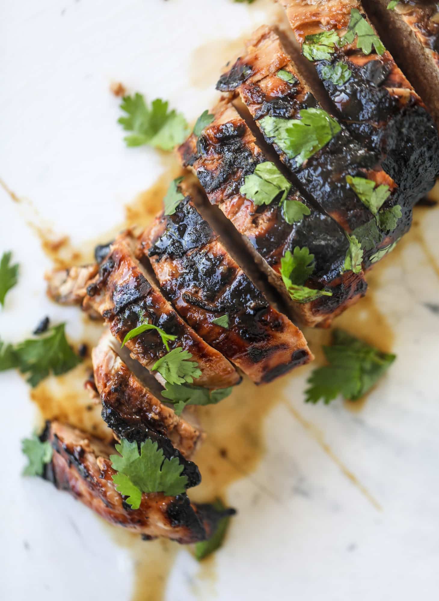 This grilled thai pork tenderloin is so easy, super flavorful, and the perfect weeknight meal when you serve it with a soda noodle salad. sliced grilled pork tenderloin