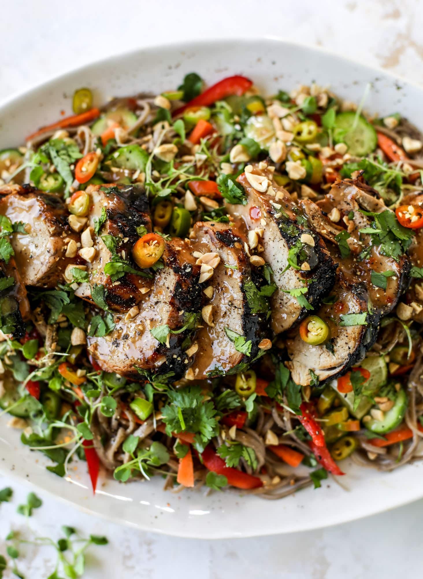 This grilled thai pork tenderloin is so easy, super flavorful, and the perfect weeknight meal when you serve it with a soda noodle salad. grilled thai pork tenderloin with soba noodle salad