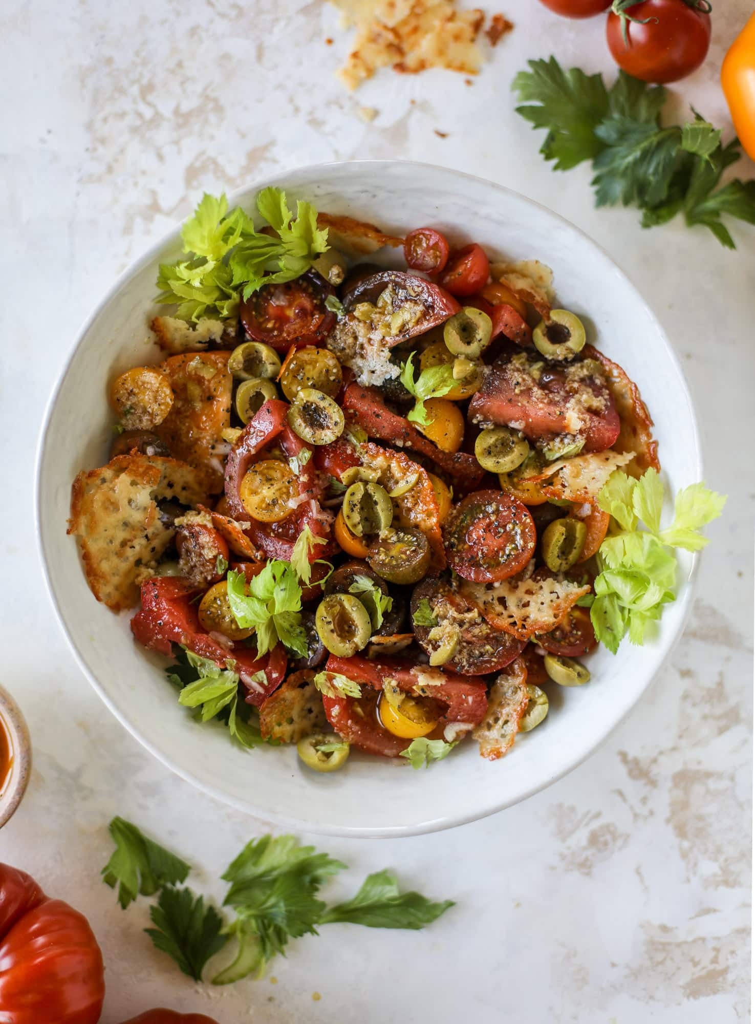 This bloody mary tomato salad has all the incredible flavor of the bloody mary cocktail! Topped with cheddar crisps, it's delicious!