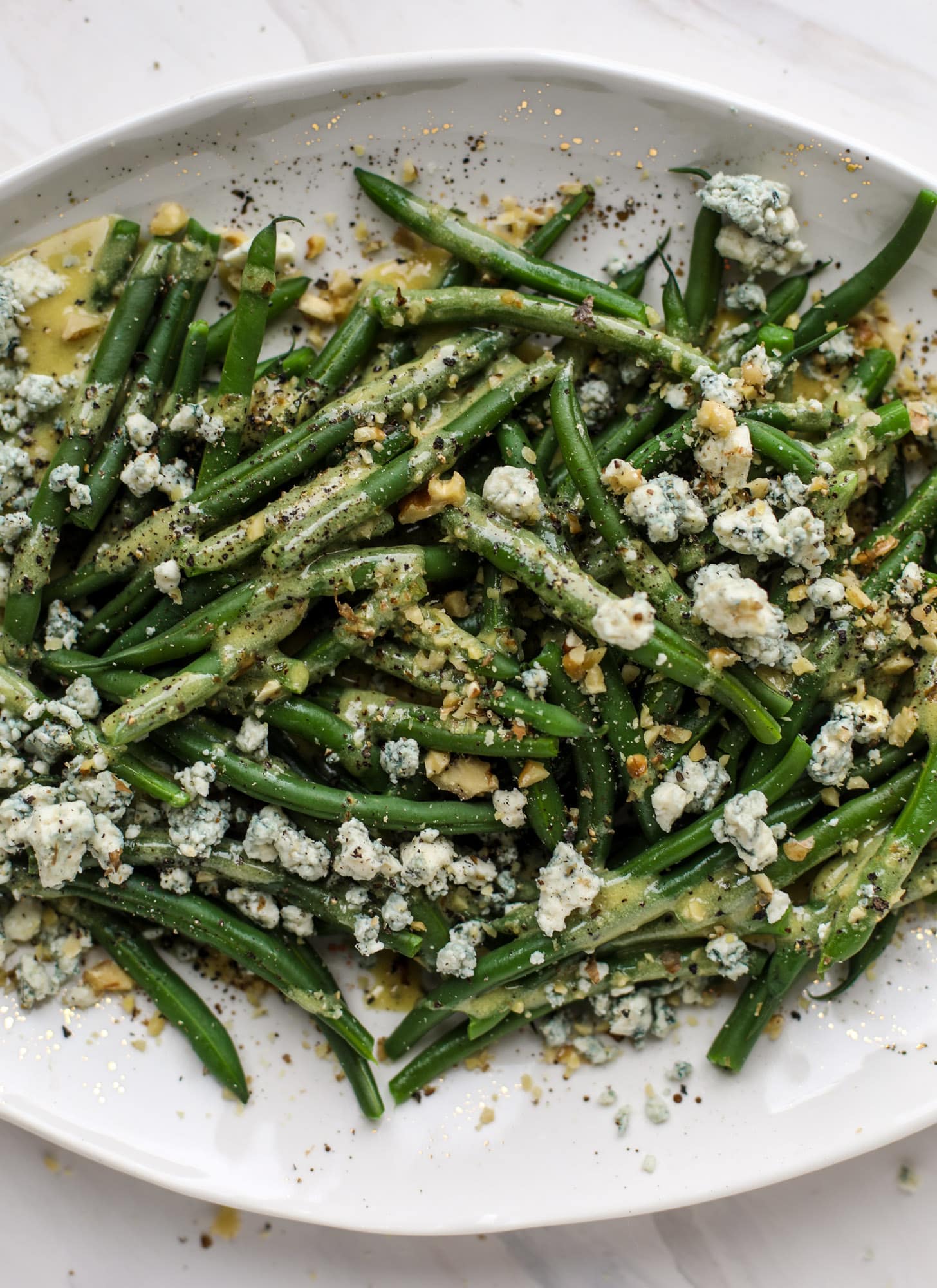 This fresh green bean salad is the ultimate summer side dish. Crisp green beans, creamy blue cheese, chopped walnuts and a dijon dressing. It's beyond!