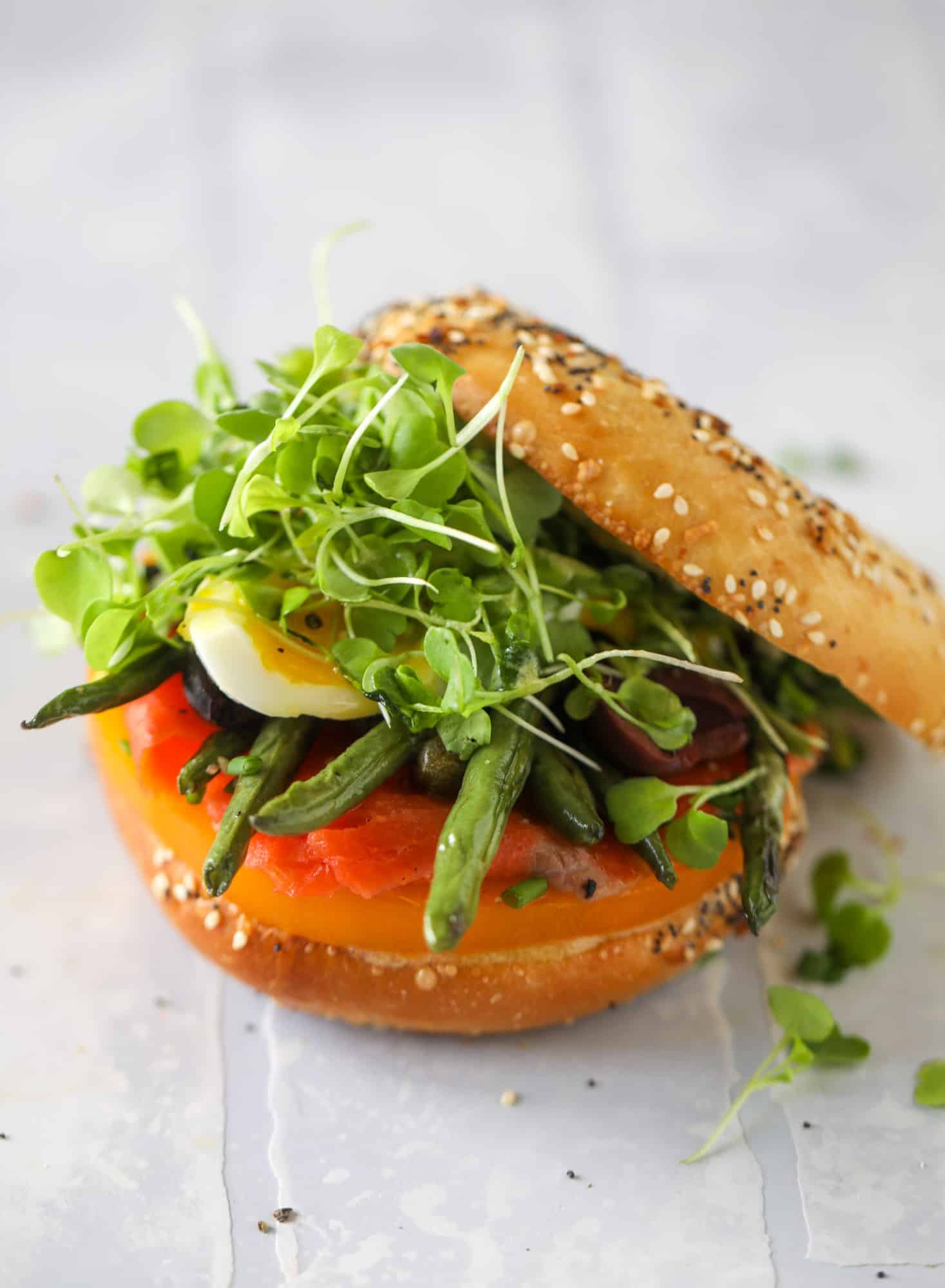 These nicoise bagels are a spin on my favorite salad! Loaded with smoked salmon, blistered green beans and tons of goodness. They are delish!