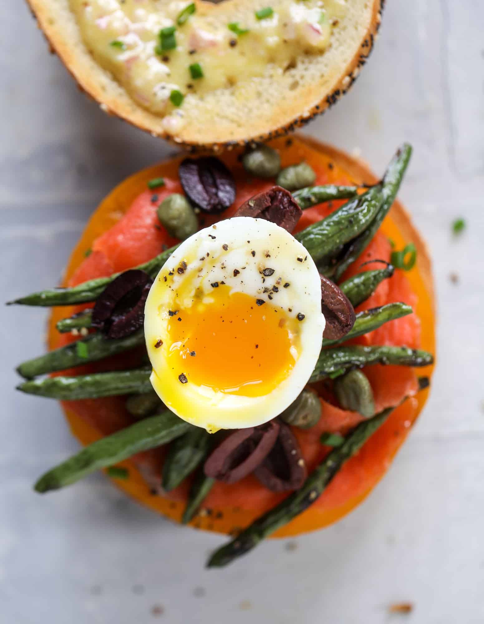 soft boiled egg on a nicoise bagel