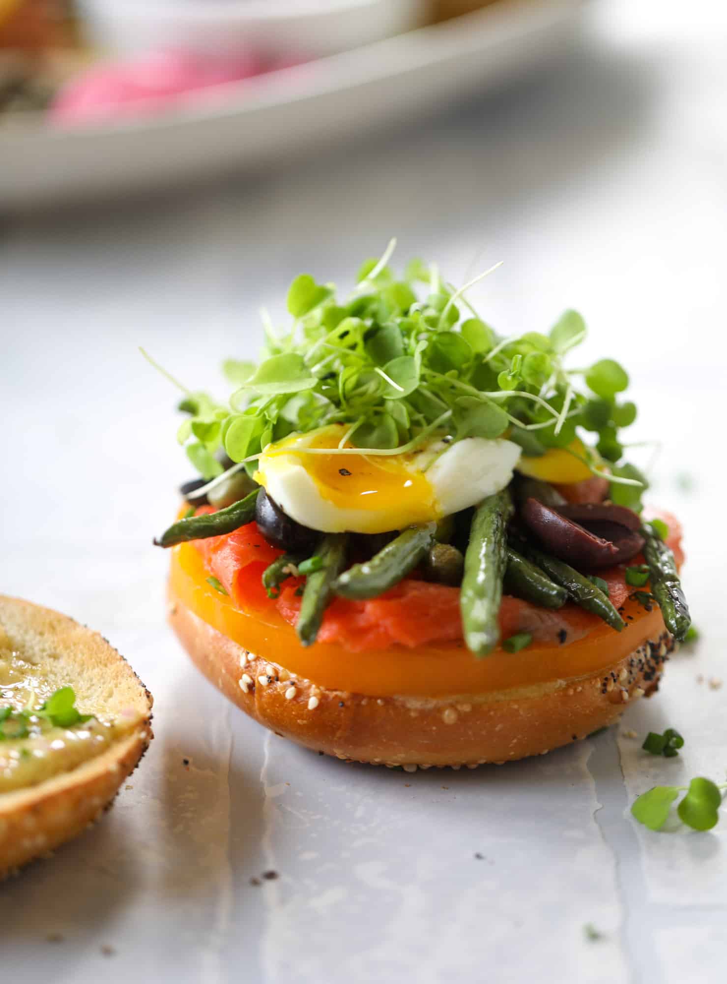 These nicoise bagels are a spin on my favorite salad! Loaded with smoked salmon, blistered green beans and tons of goodness. They are delish!