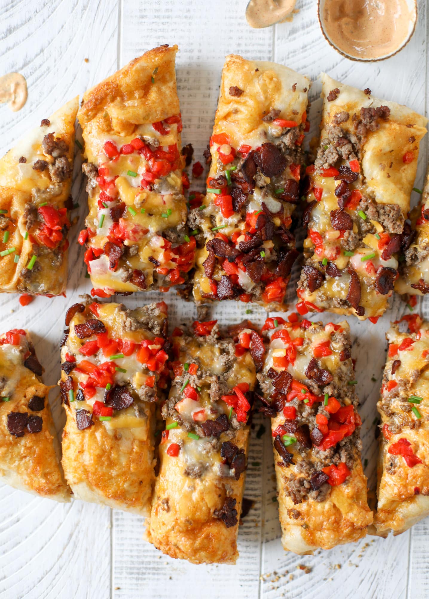 This grilled cheeseburger pizza is my take on the smoke shack burger! Cheddar, bacon, cherry peppers and special sauce make this impossible to resist.