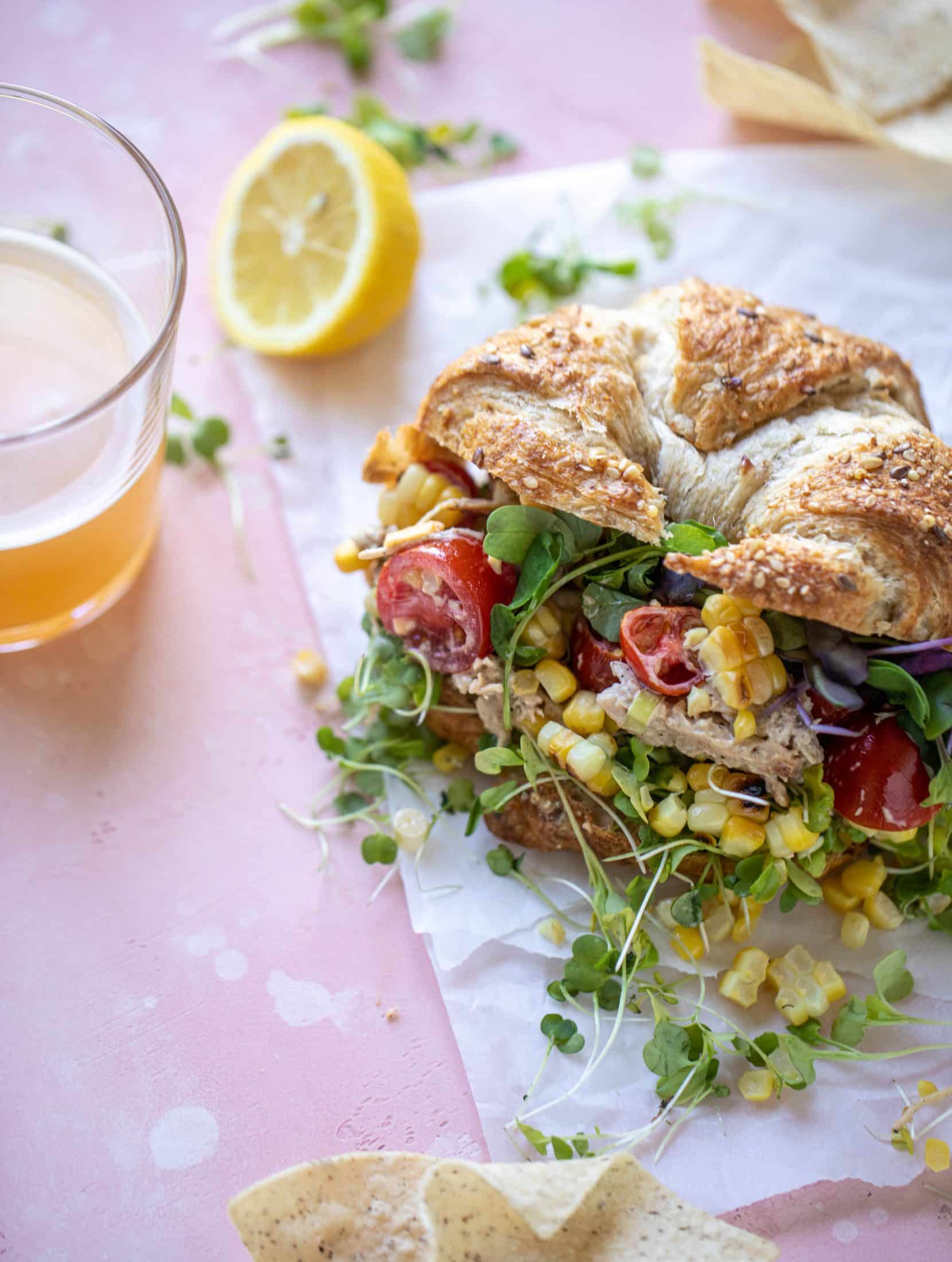 This smoky summer chicken salad is incredible! So much flavor from grilled chicken, sweet cherry tomatoes, corn, cheddar cheese and a secret ingredient!