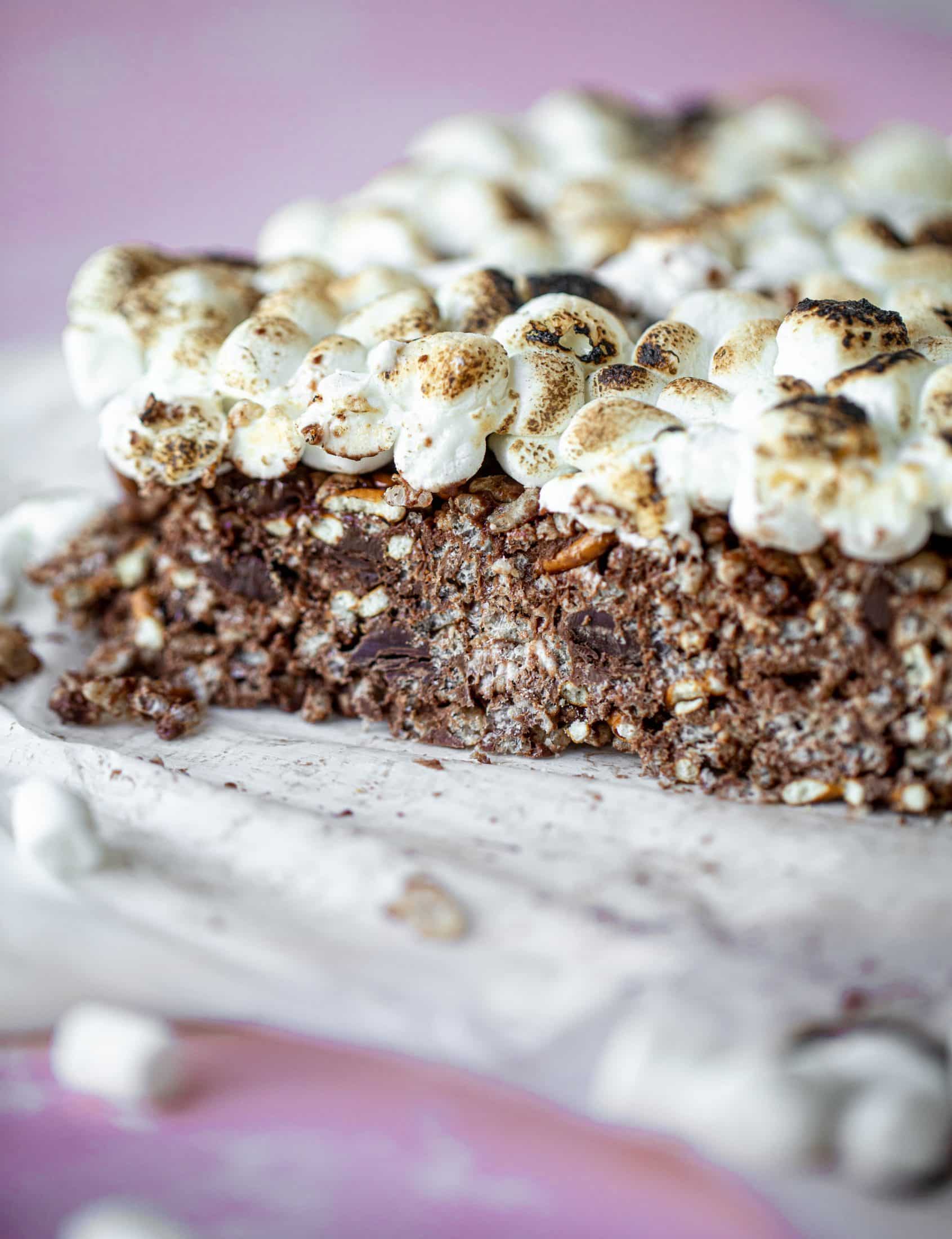 These indulgent s'mores bars are crispy and crunchy and studded with salted pretzels! Toasted marshmallow and dark chocolate make these the best treat ever!