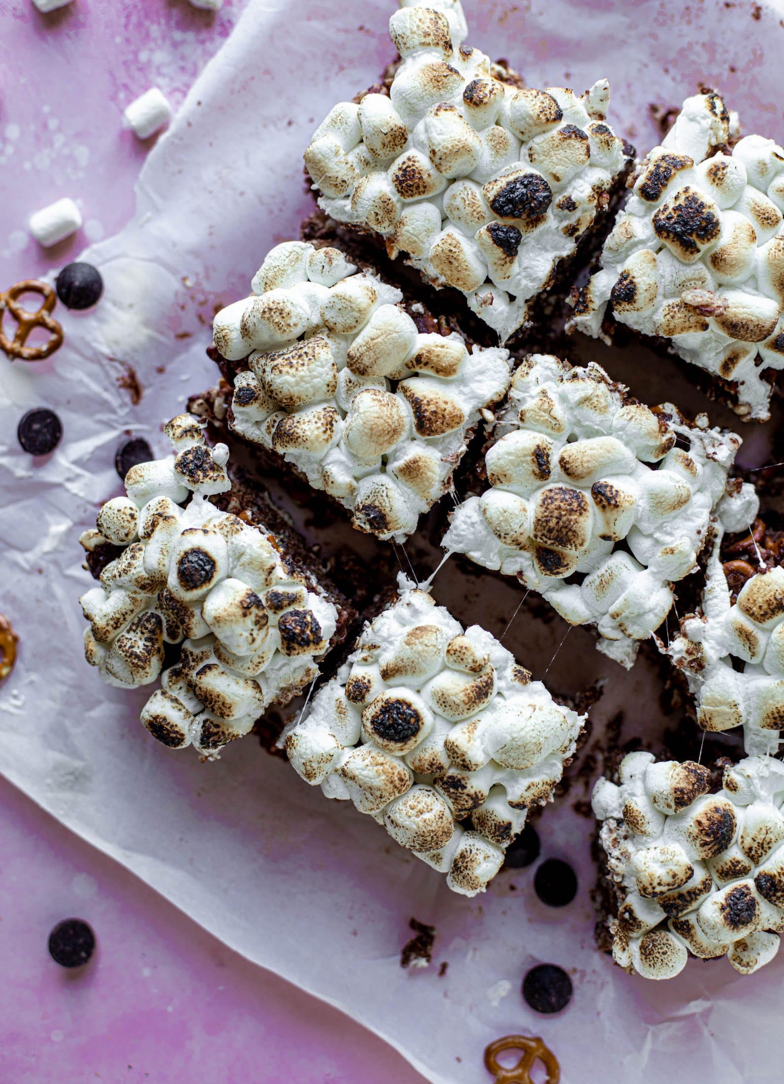 These indulgent s'mores bars are crispy and crunchy and studded with salted pretzels! Toasted marshmallow and dark chocolate make these the best treat ever!