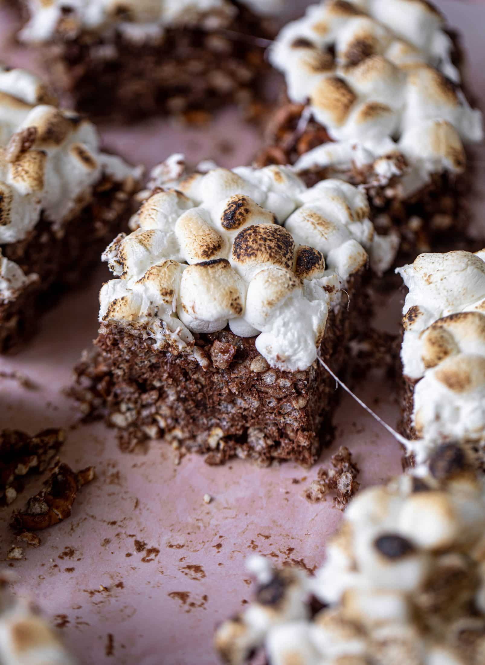 These indulgent s'mores bars are crispy and crunchy and studded with salted pretzels! Toasted marshmallow and dark chocolate make these the best treat ever!