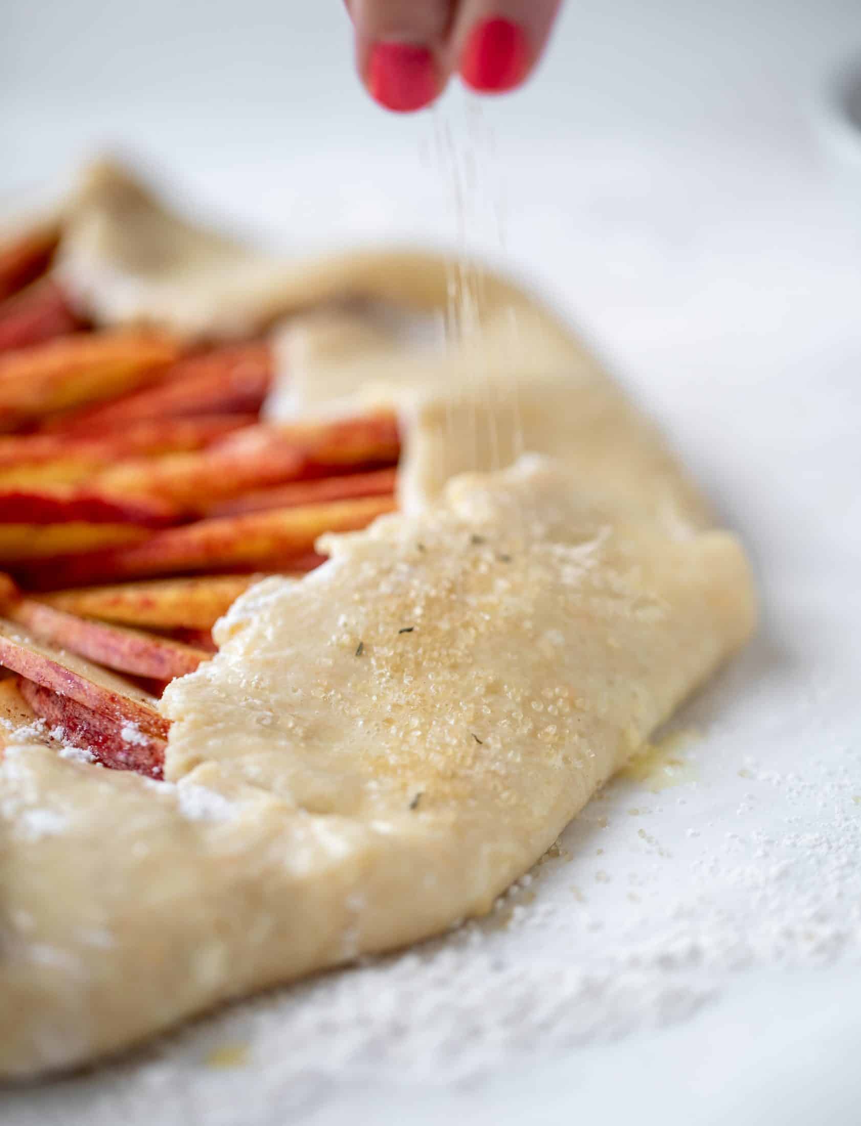 This apple cheddar galette is made with honeycrisp apples, set in a cheddar herb crust and brushed with thyme butter! So delicious and perfect for fall.