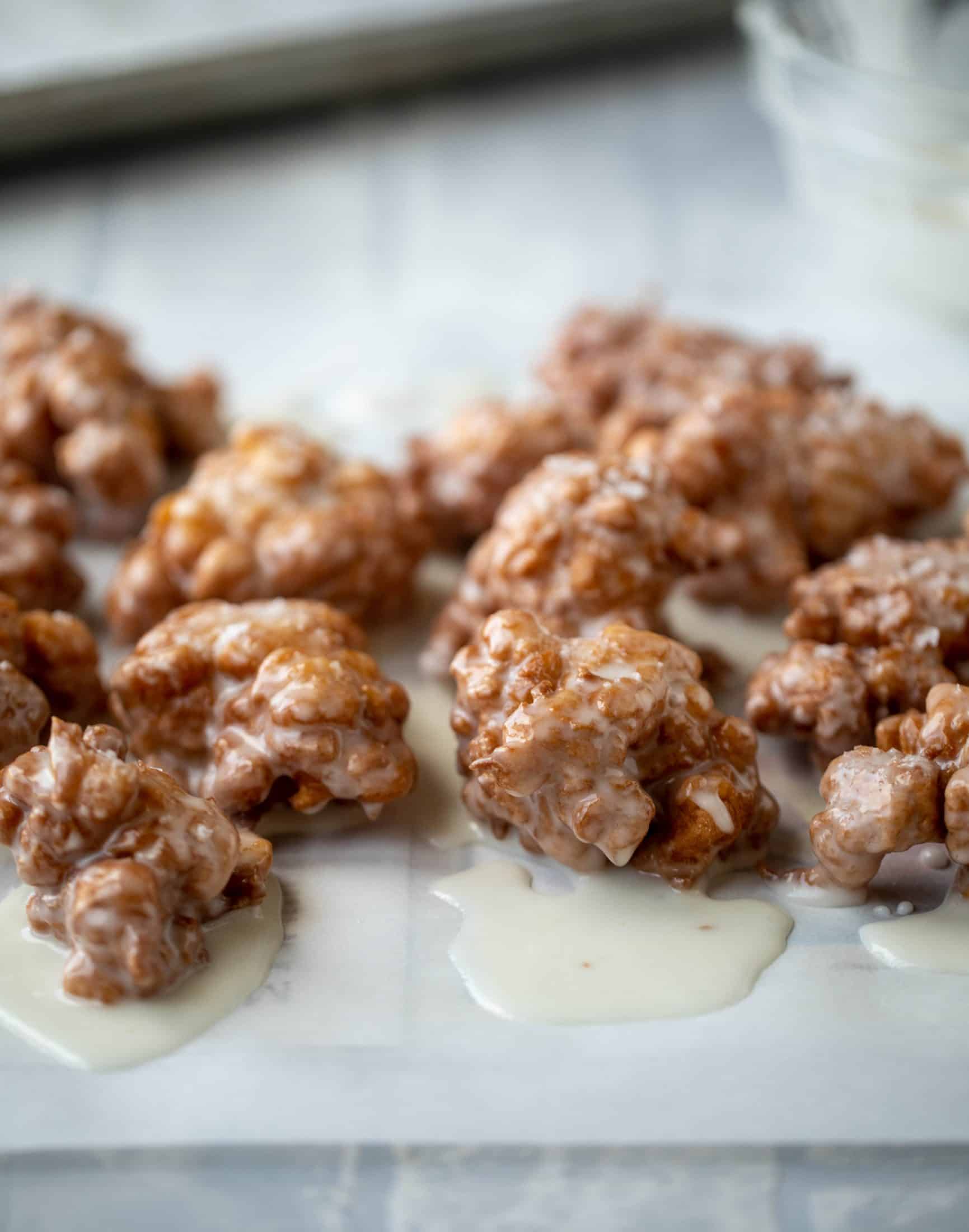 These salted apple fritters use honeycrisp apples and flaked sea salt for a fall flavor explosion. These are the best treat ever!
