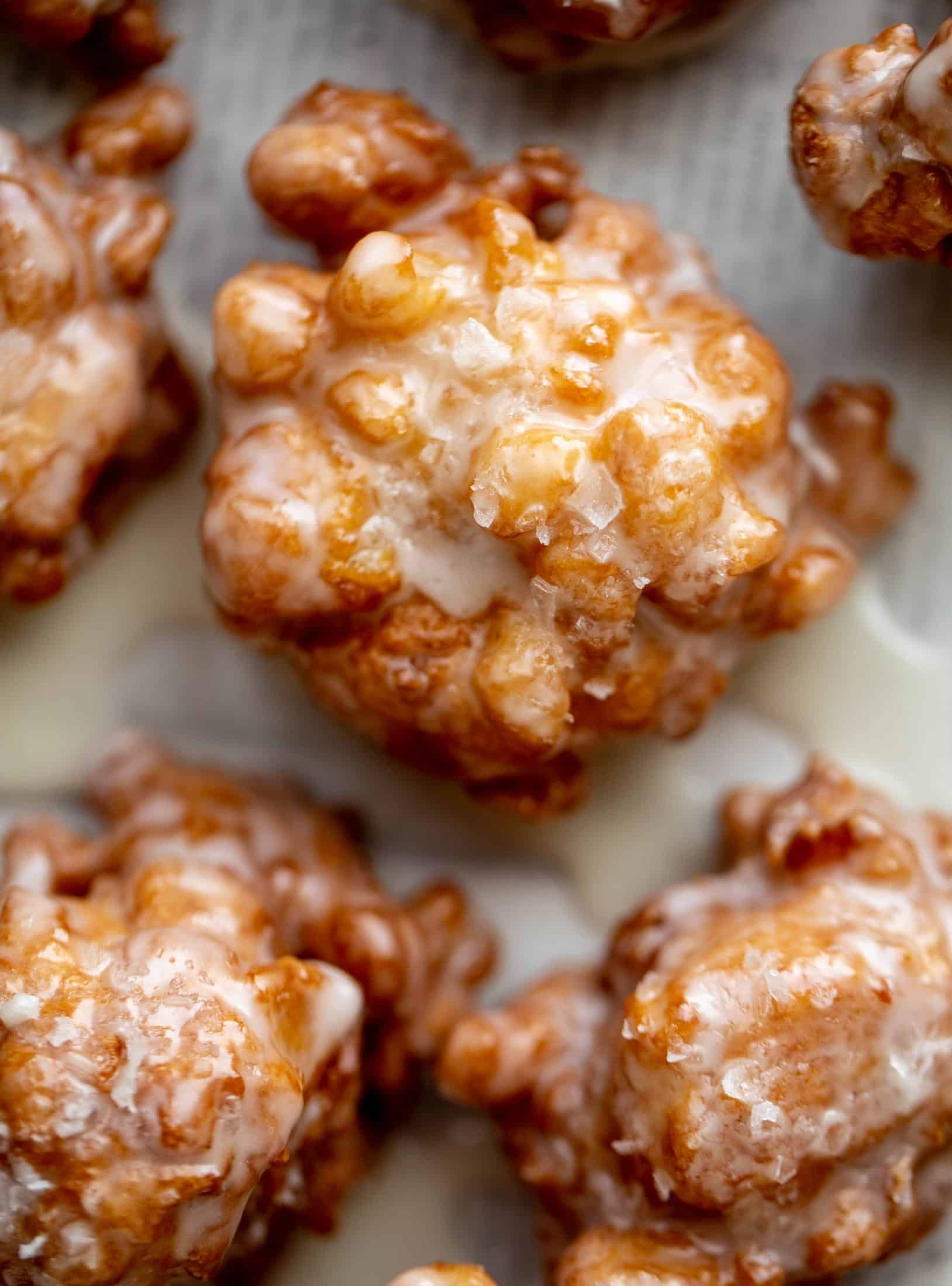 These salted apple fritters use honeycrisp apples and flaked sea salt for a fall flavor explosion. These are the best treat ever!