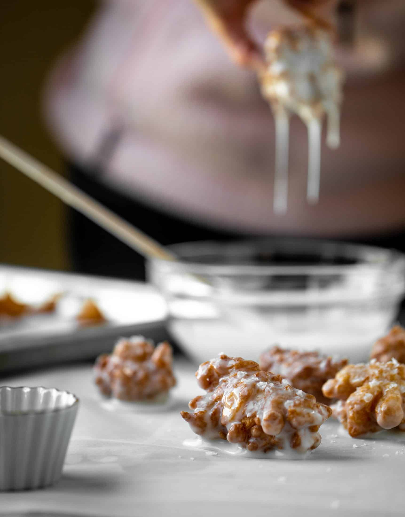 These salted apple fritters use honeycrisp apples and flaked sea salt for a fall flavor explosion. These are the best treat ever!