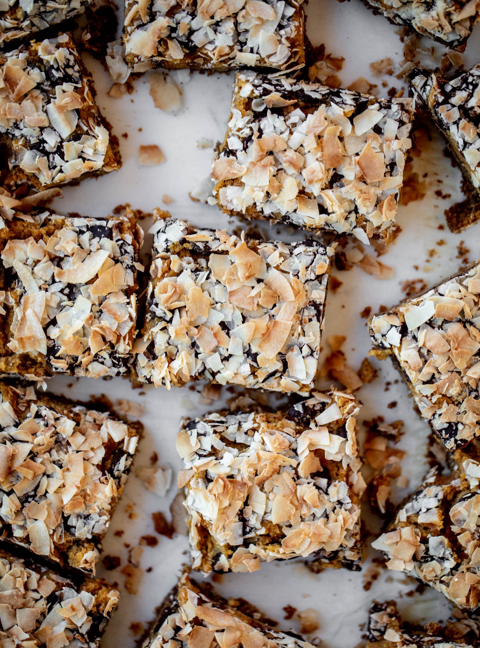 Pumpkin gooey bars are a decadent chocolate, coconut and pumpkin dessert! Crunchy graham crust, gooey pumpkin center and a crisp topping. Yum!