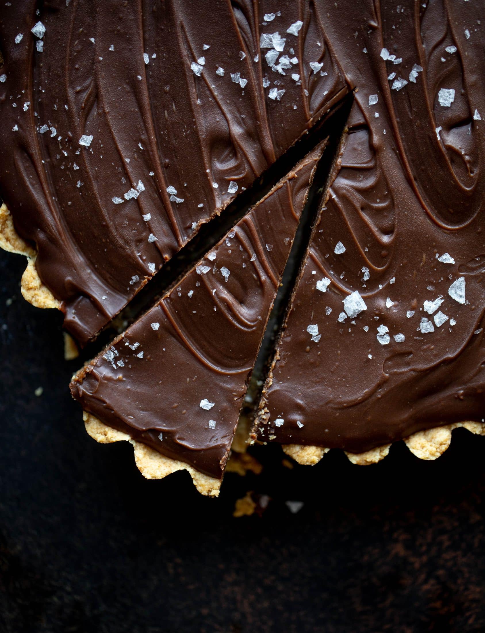 This snickers almond tart is made with an almond crust, homemade almond butter caramel and a chocolate ganache. It's to die for!
