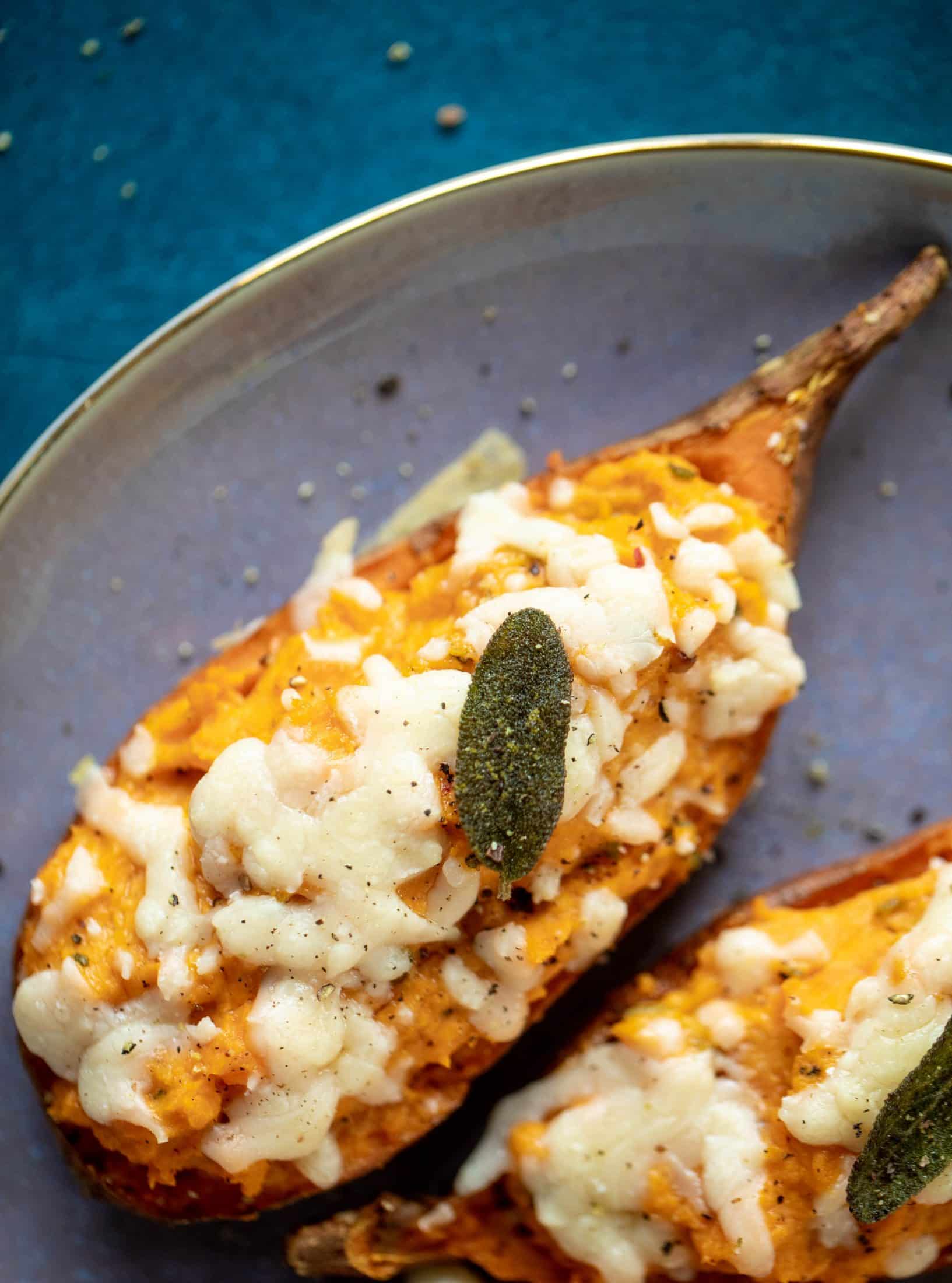 These twice baked sweet potatoes are whipped with crispy sage and pumpkin puree! Topped with cheese and baked until melty, they are super delish.