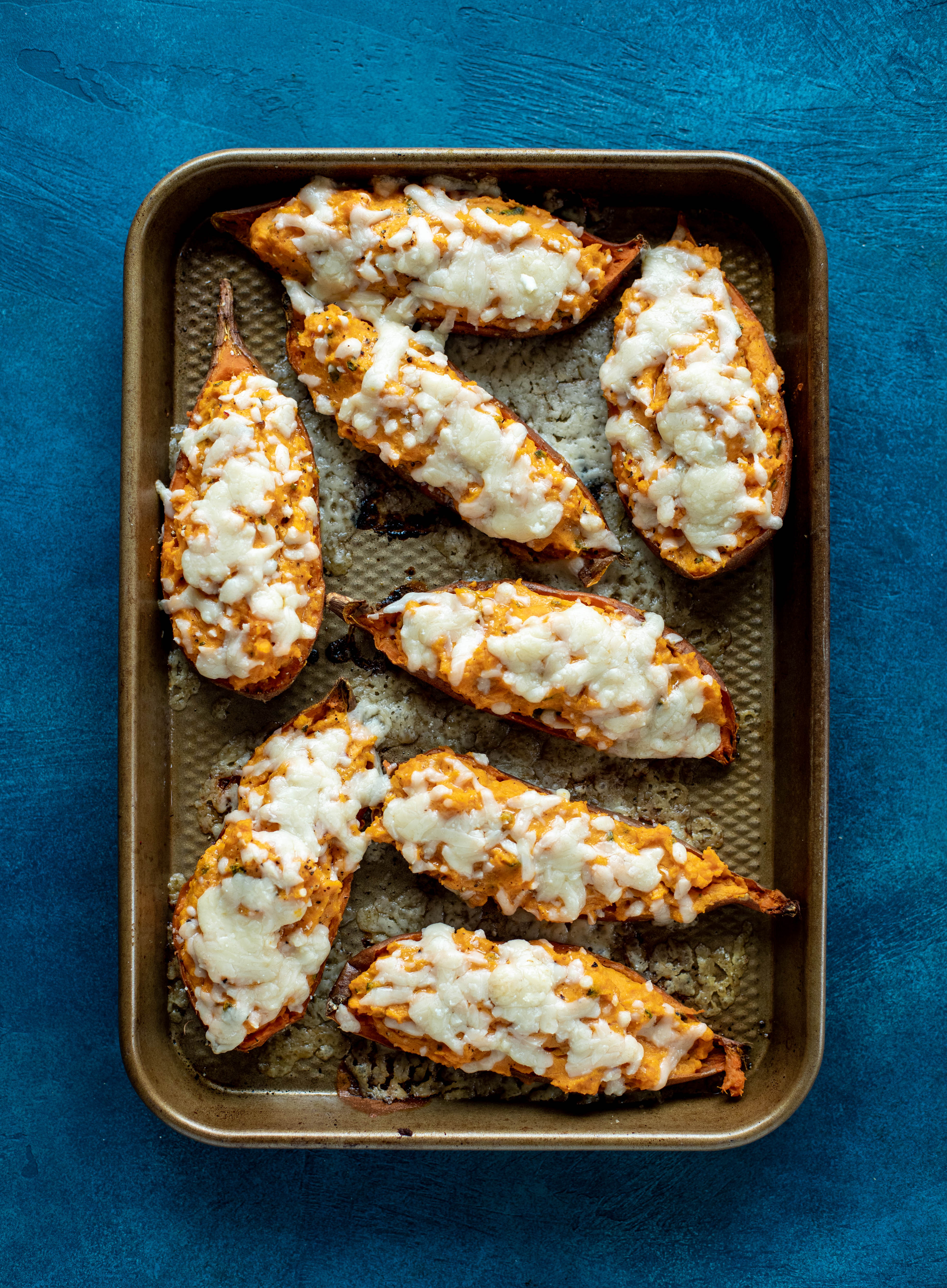 These twice baked sweet potatoes are whipped with crispy sage and pumpkin puree! Topped with cheese and baked until melty, they are super delish.