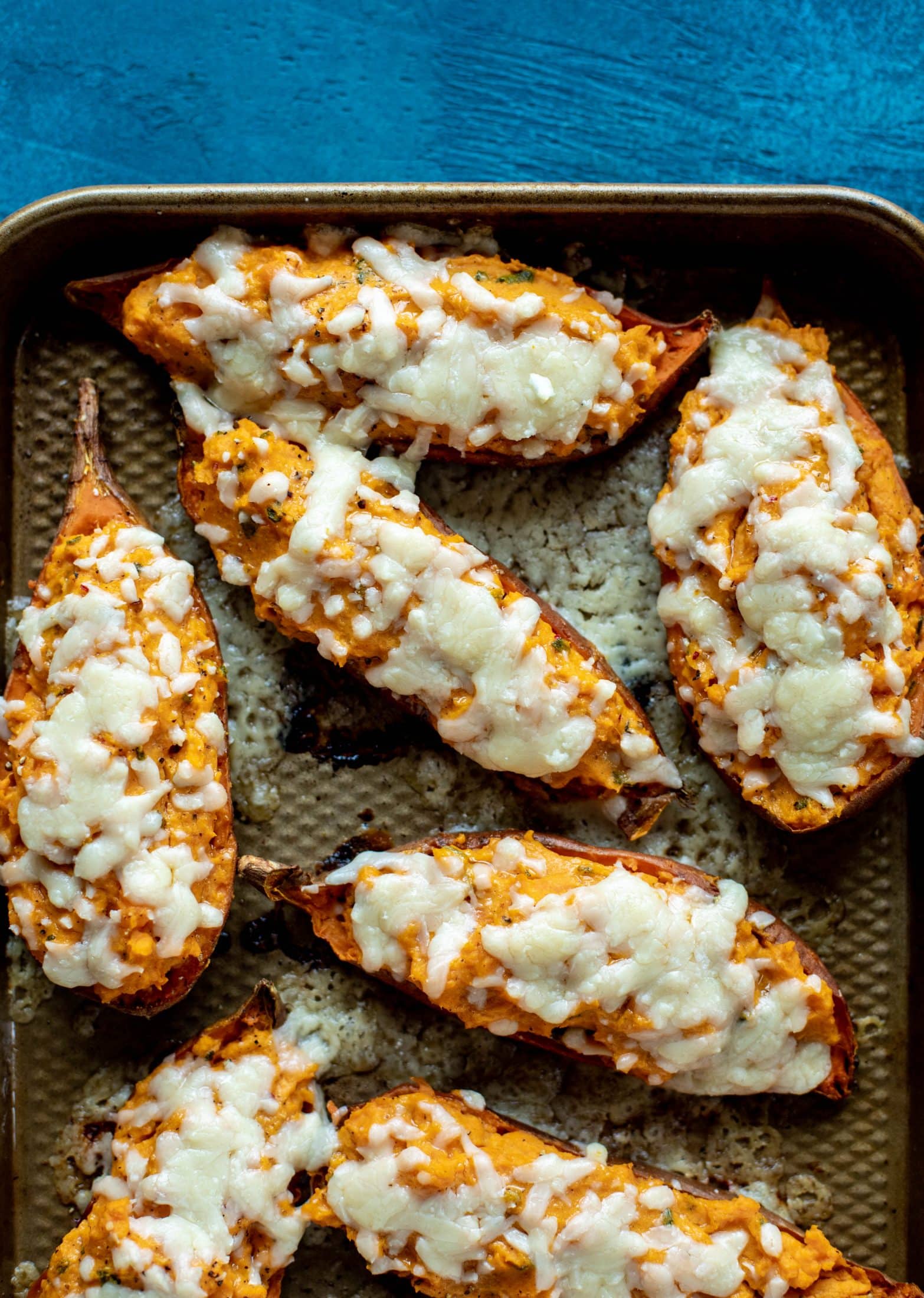 These twice baked sweet potatoes are whipped with crispy sage and pumpkin puree! Topped with cheese and baked until melty, they are super delish.