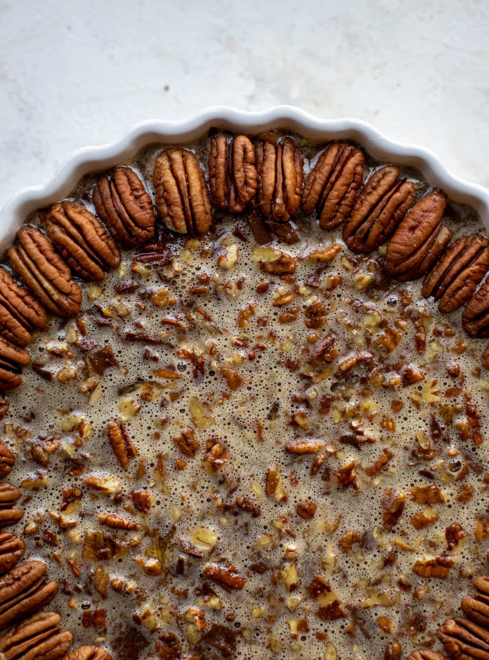 This chocolate pecan tart is the best dessert ever. Chocolate fudge and gooey pecan pie in a shortbread crust - everyone goes crazy!