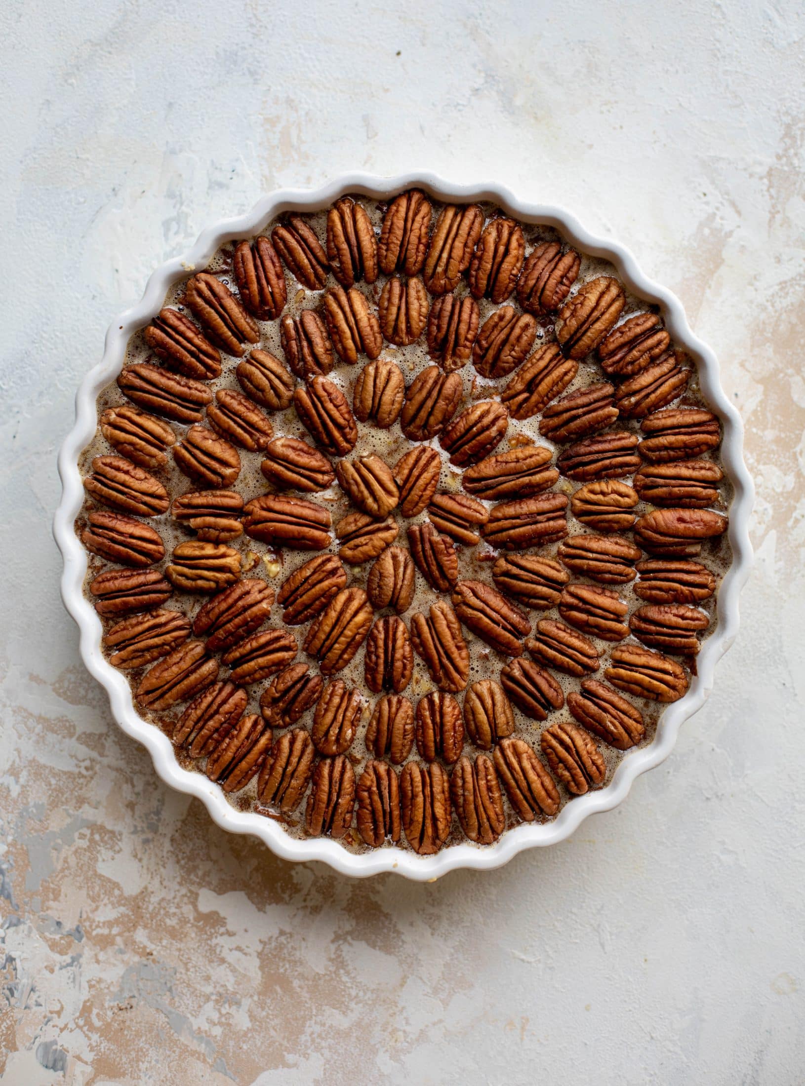 This chocolate pecan tart is the best dessert ever. Chocolate fudge and gooey pecan pie in a shortbread crust - everyone goes crazy!