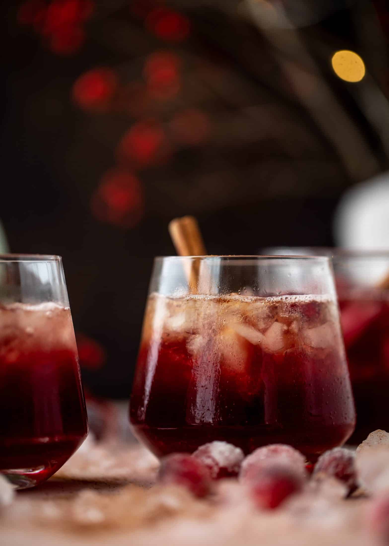 This cranberry cobbler smash is perfect for the holiday season! Bourbon, cinnamon simple syrup and cranberry juice - it's spiced and warming and wonderful.