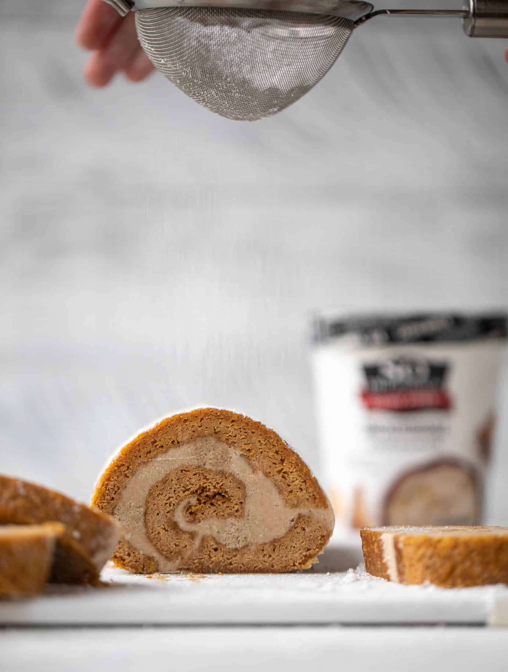 This frozen pumpkin roll is a delicious twist on the classic! Ice cream or non-dairy dessert is spread inside a classic pumpkin roll and serve frozen!