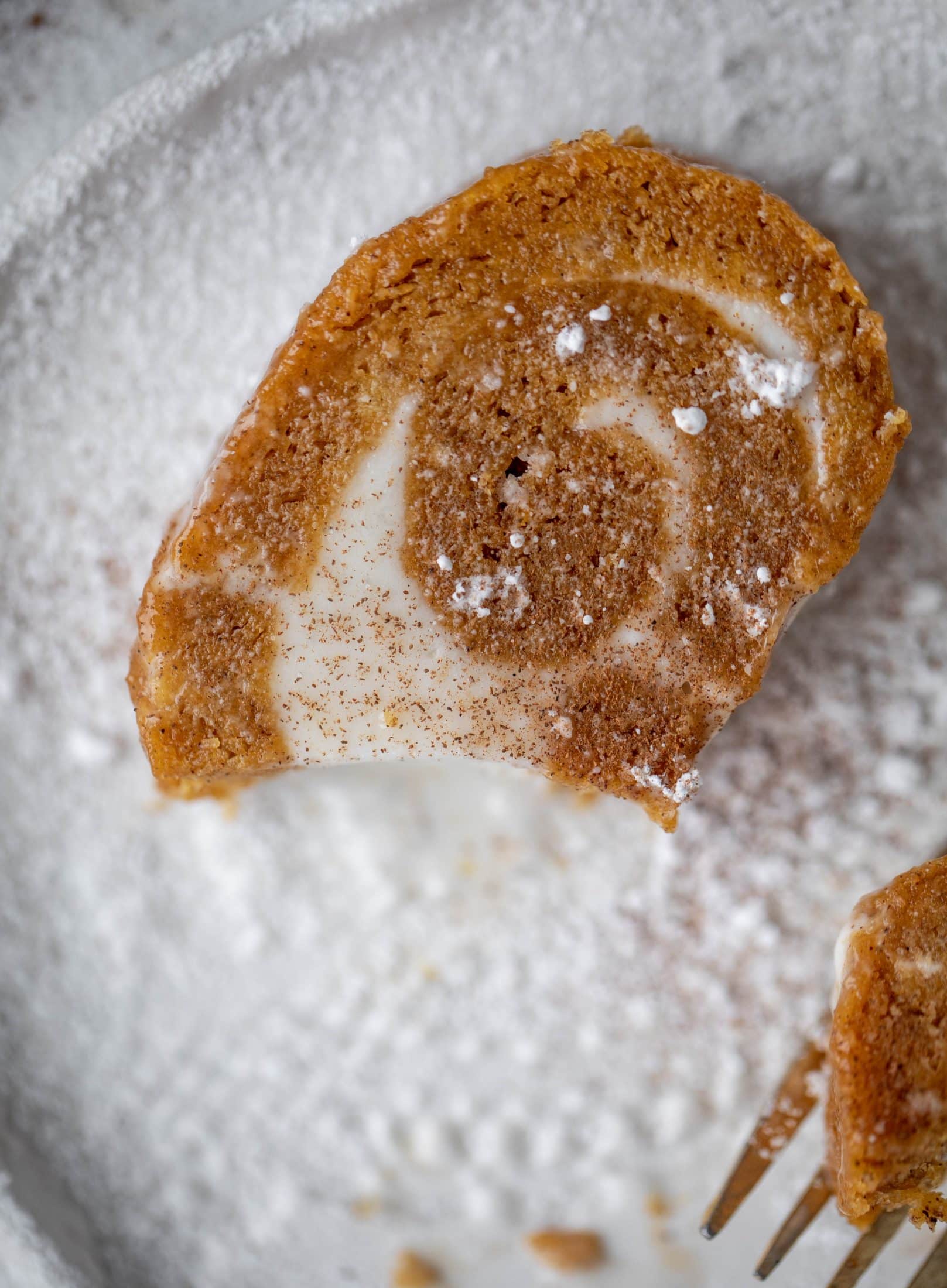 This frozen pumpkin roll is a delicious twist on the classic! Ice cream or non-dairy dessert is spread inside a classic pumpkin roll and serve frozen!
