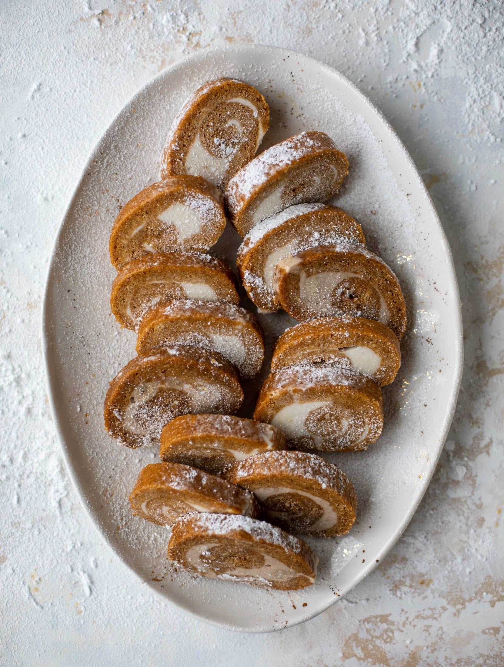 This frozen pumpkin roll is a delicious twist on the classic! Ice cream or non-dairy dessert is spread inside a classic pumpkin roll and serve frozen!