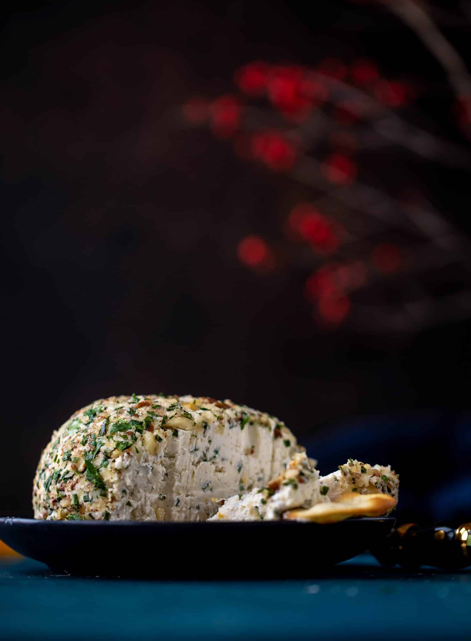 This macadamia nut cheeseball is flavored with fresh orange, spices, crispy sage and pecorino cheese. It's the perfect make-ahead snack!