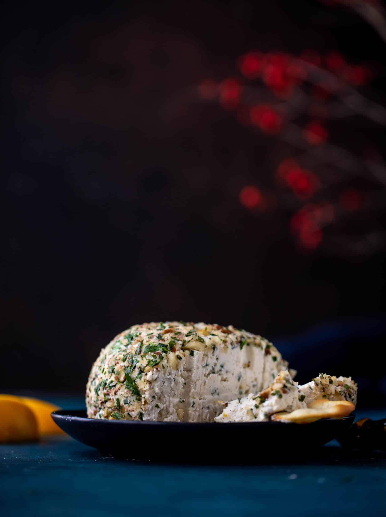 This macadamia nut cheeseball is flavored with fresh orange, spices, crispy sage and pecorino cheese. It's the perfect make-ahead snack!