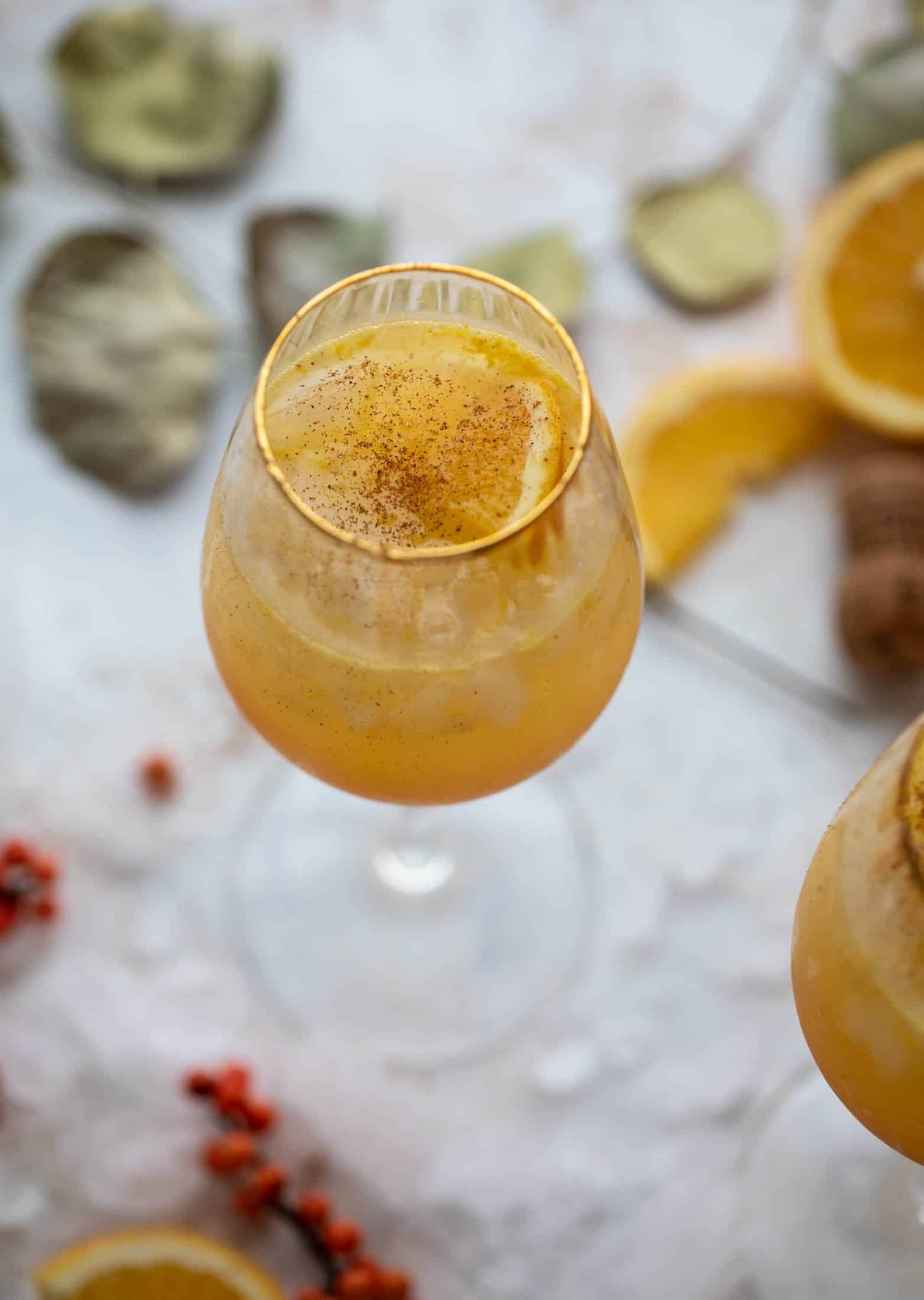 The spiced orange spritzer is a fancier mimosa and similar to an aperol spritz! A fresh spiced orange juice based mixed with prosecco and seltzer. So good!