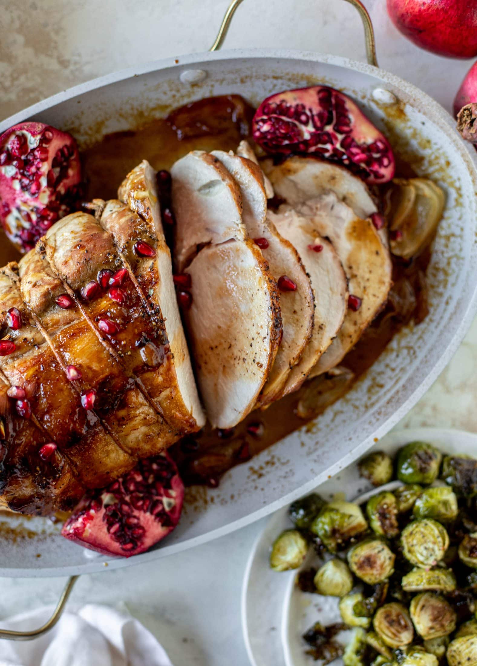 This pork loin roast is perfect for the holiday or winter season! Pomegranate and cider glazed, it's wonderful! Serve with smashed rosemary potatoes.