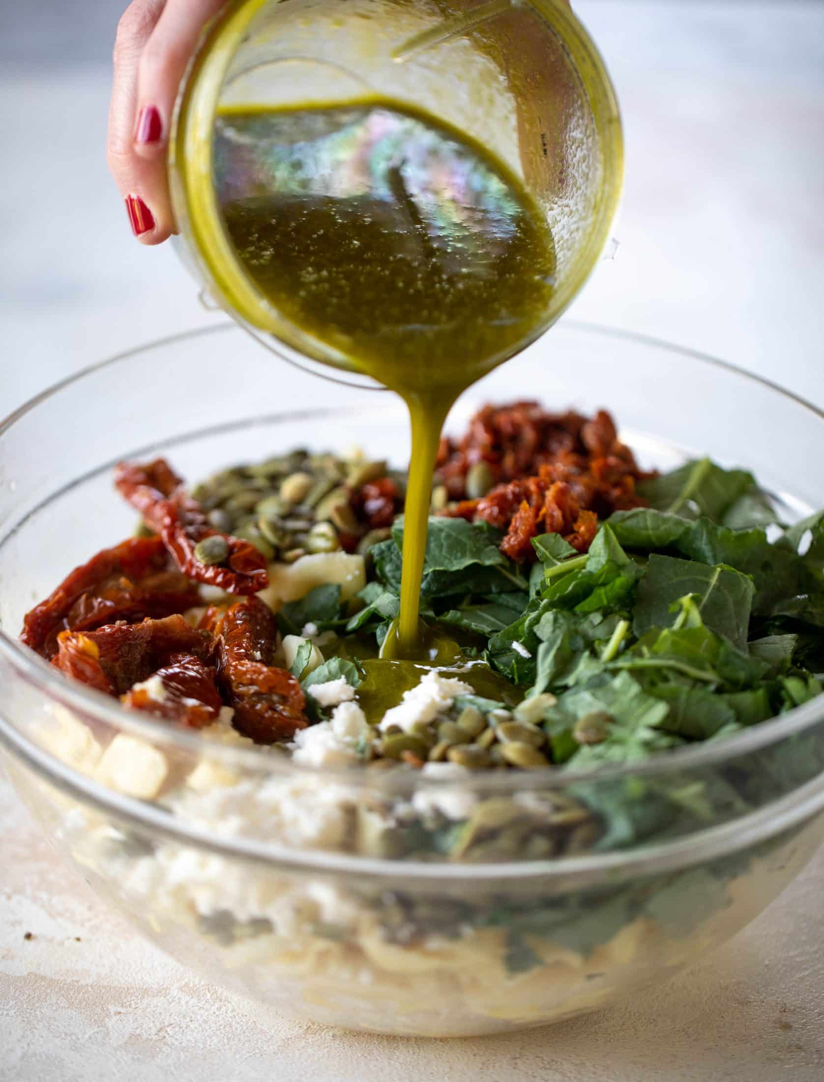 This cilantro lime tortellini salad is loaded with flavor! Served warm or cold, it has pepitas, sun dried tomatoes and crumbled feta. It's ridiculously good!
