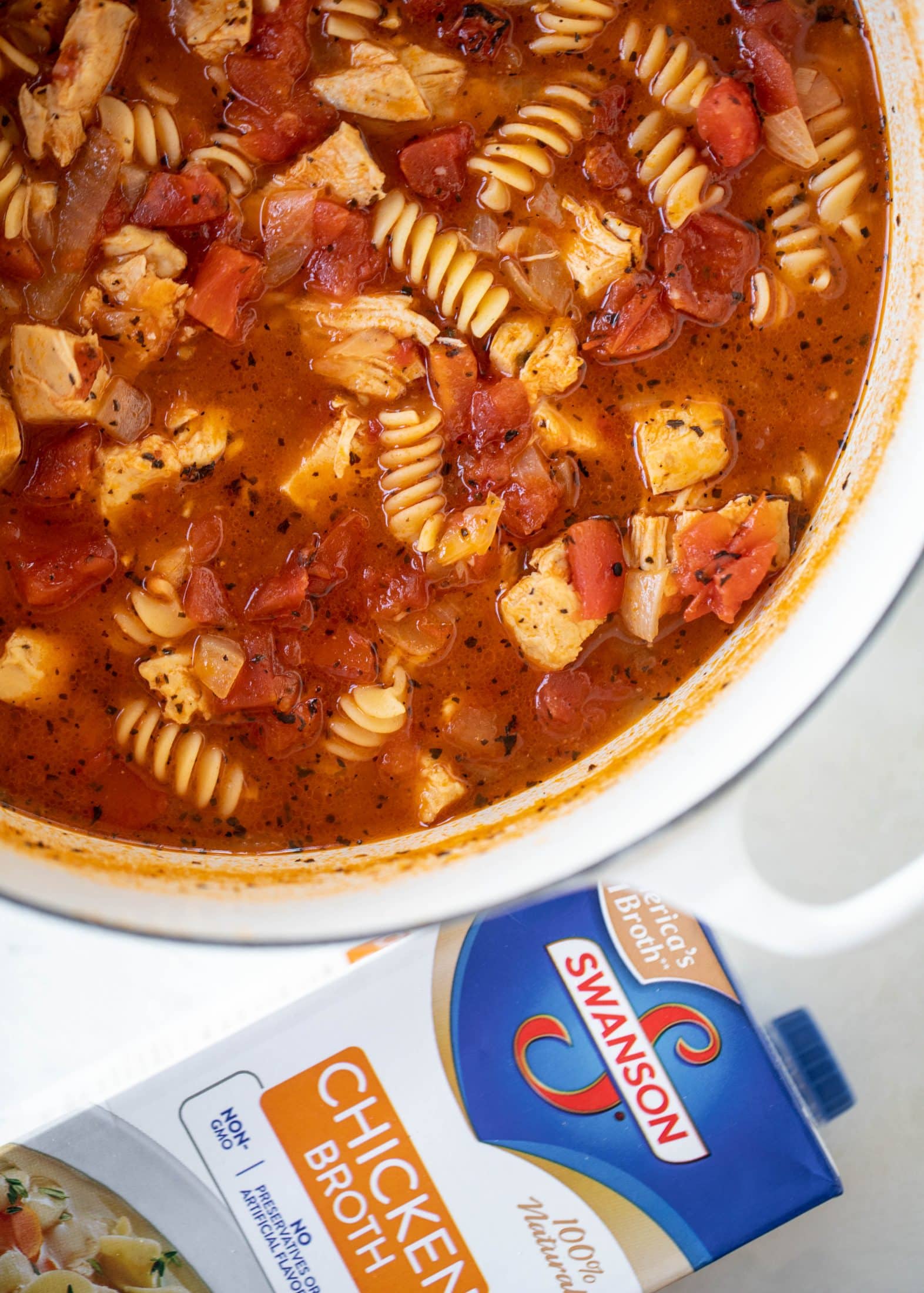 This chicken parmesan soup is ridiculously flavorful and so easy to make! Juicy chicken with pasta, fire roasted tomatoes and mozzarella croutons. Yum!