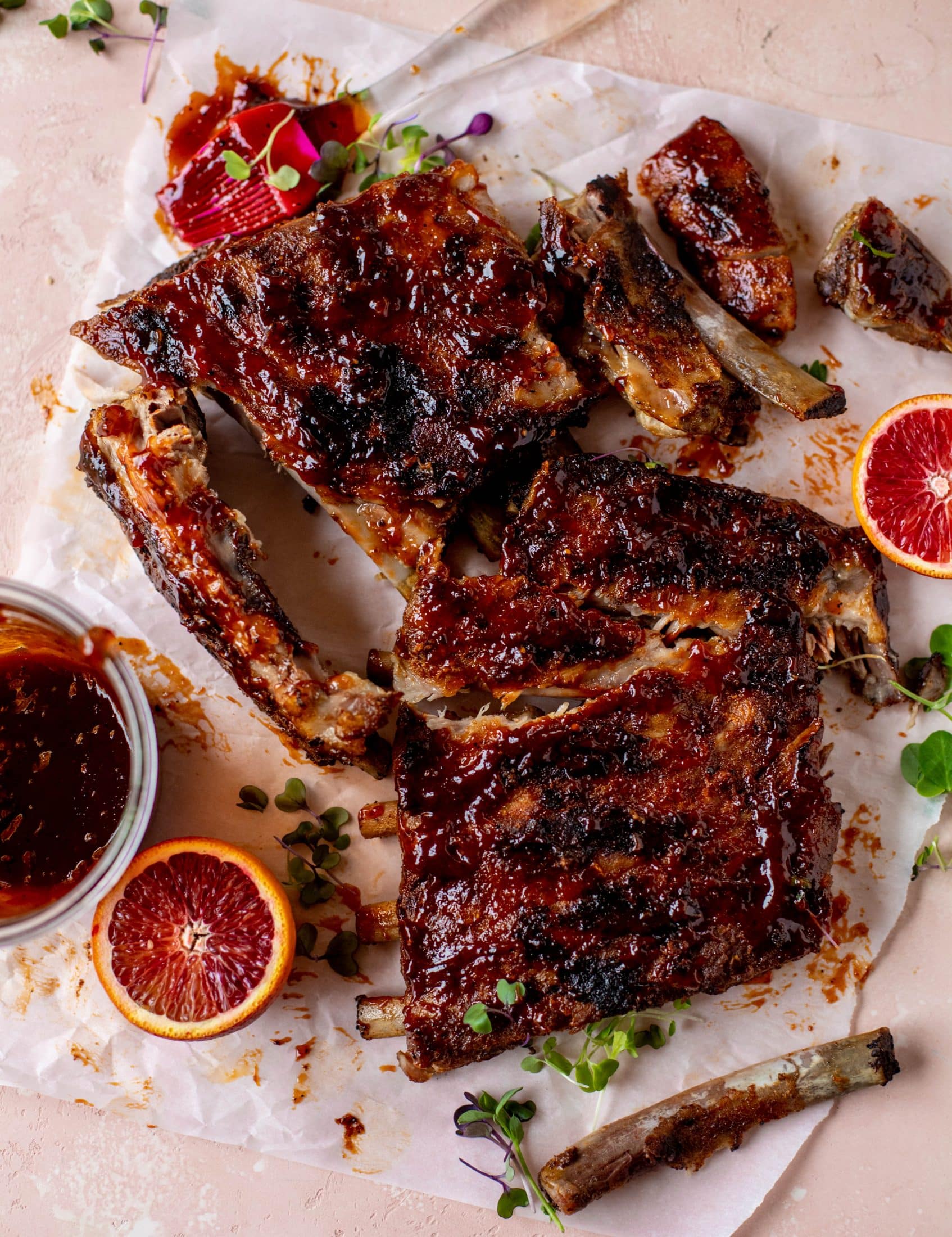These blood orange BBQ ribs are smoky, sweet, sticky and oh-so good. Serve alongside an avocado butter greens salad for the ultimate combo!