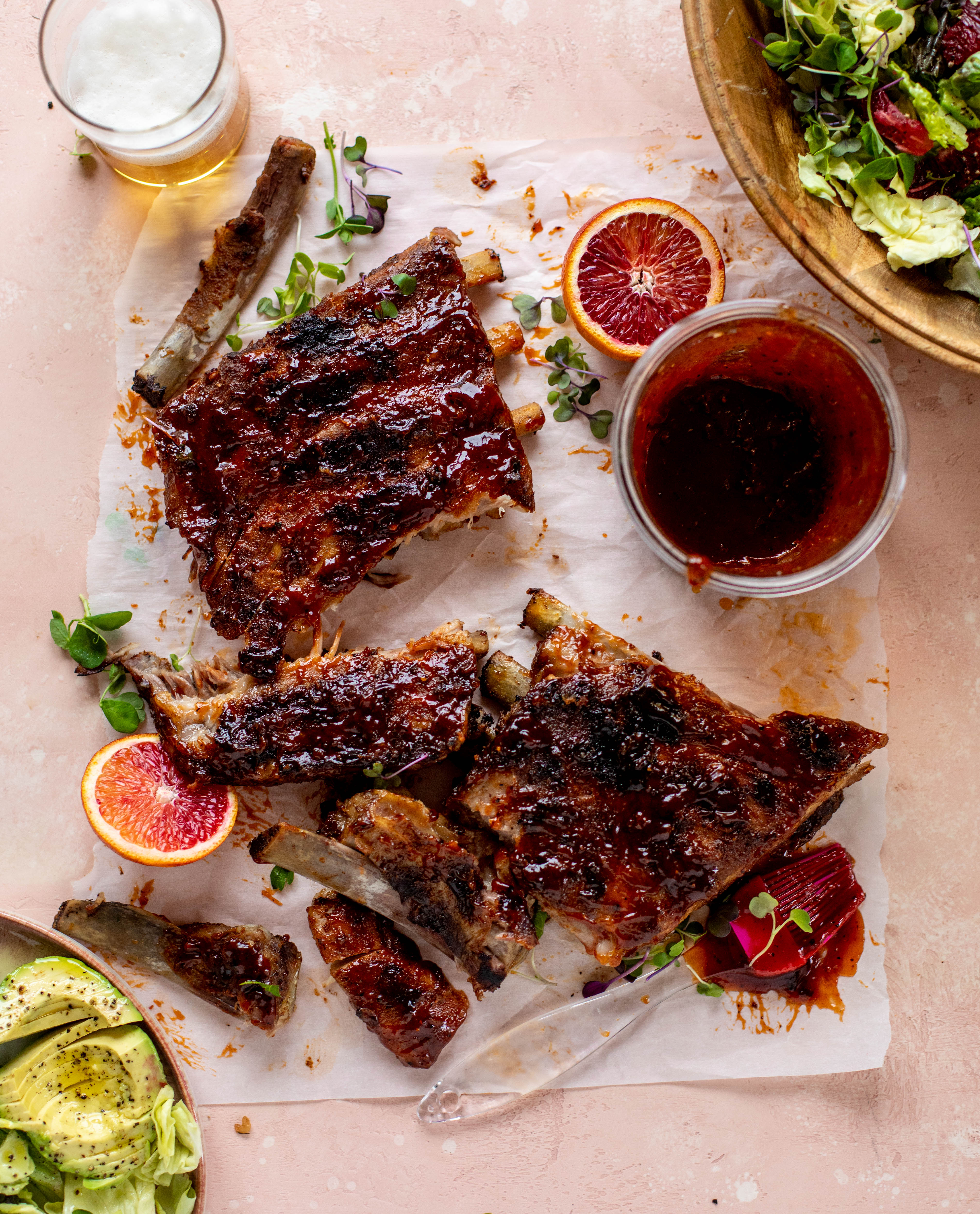 These blood orange BBQ ribs are smoky, sweet, sticky and oh-so good. Serve alongside an avocado butter greens salad for the ultimate combo!
