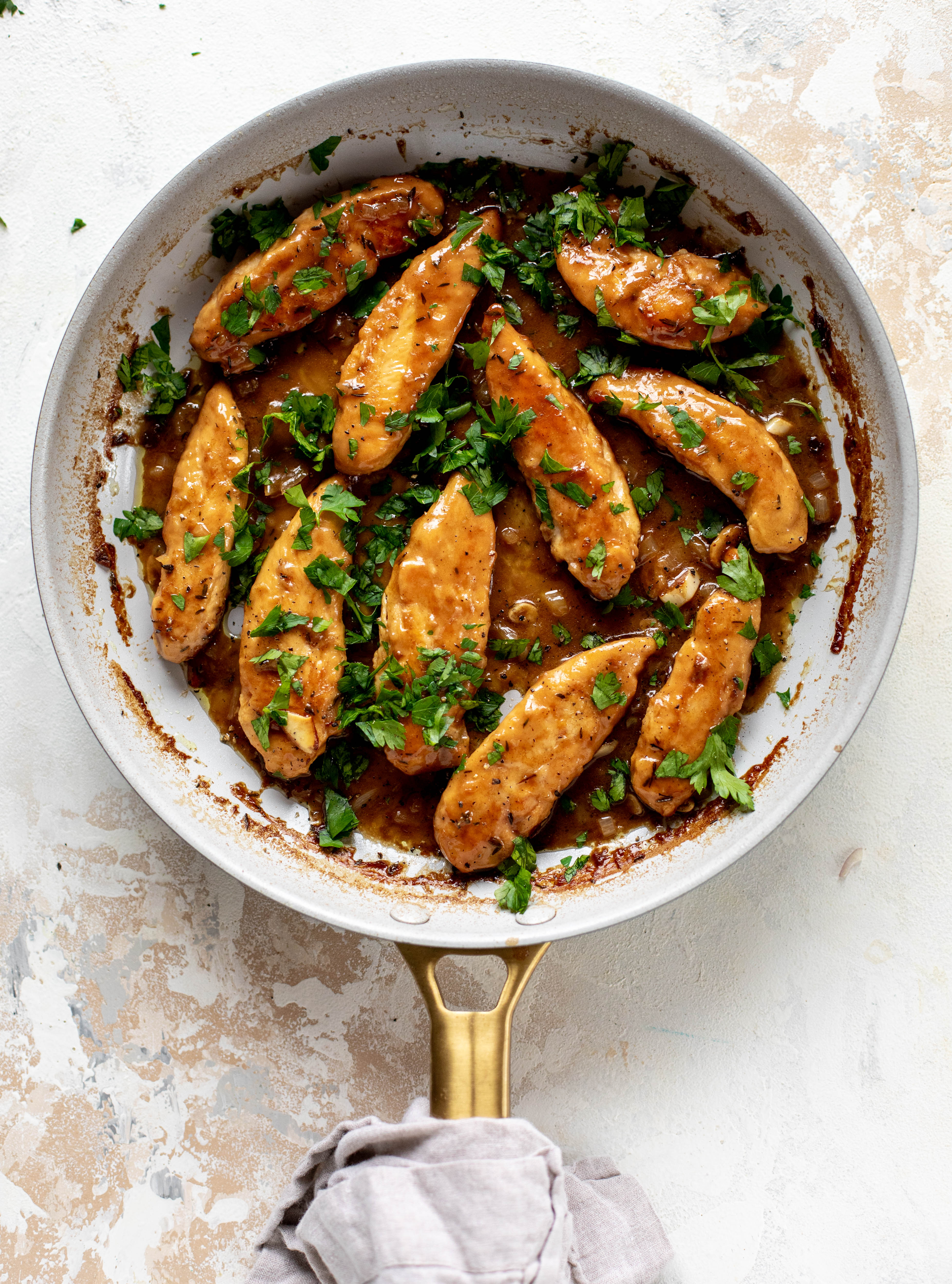 My mom's chicken marsala is easy and ridiculously flavorful! It's made without mushrooms and served alongside almond brown butter green beans.